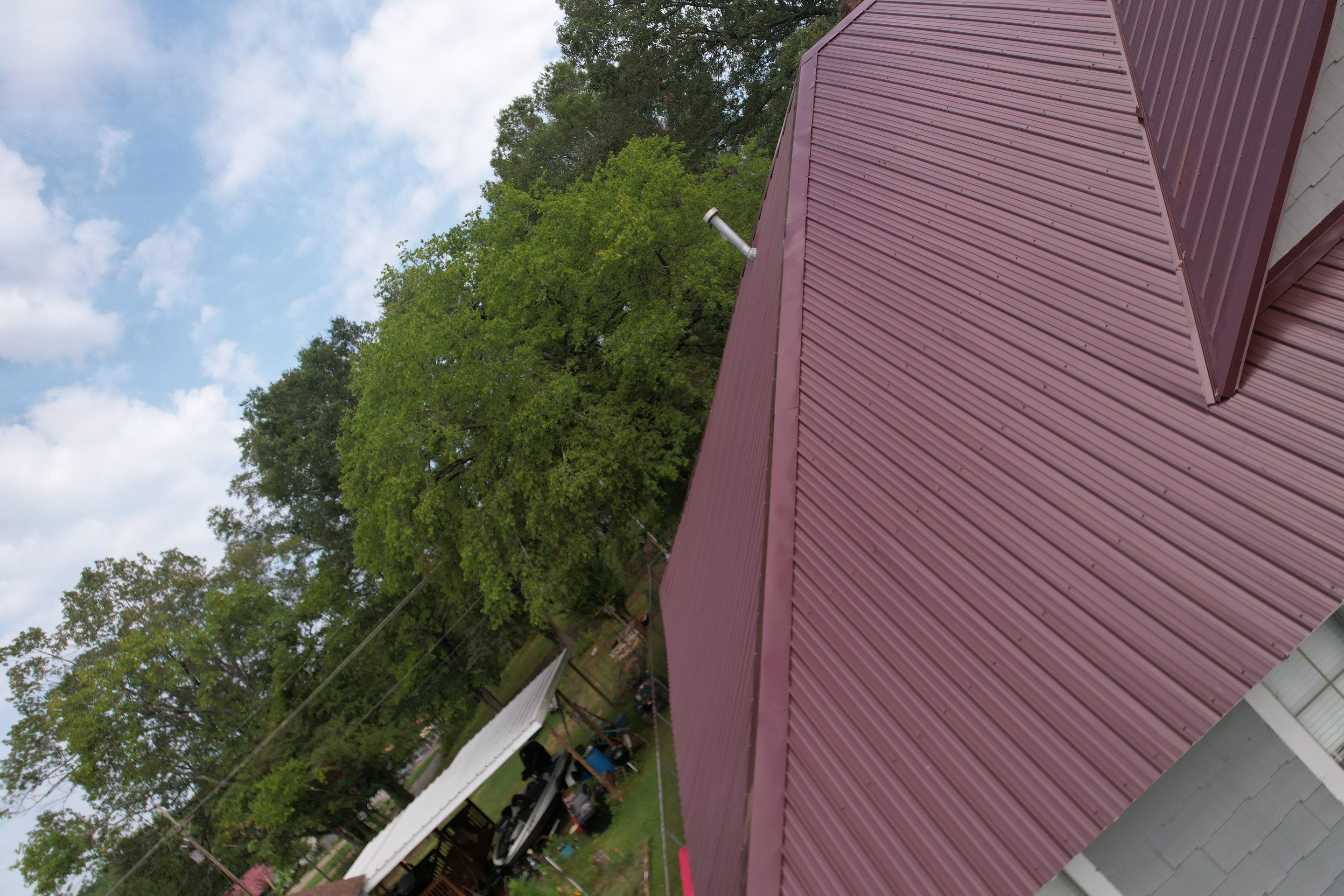 Residential Metal Roof Replacement using Reed's Metals: Colored Residental Panel (Burgundy) by Hostetler Roofing