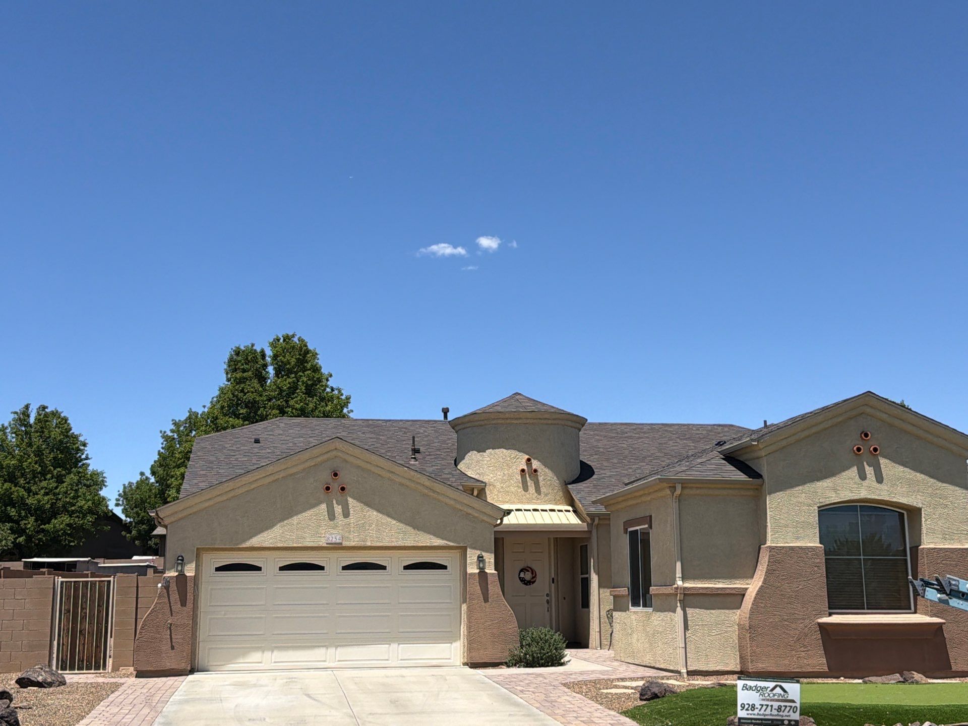 Residential Roofing Installation with Architectural Shingles and Turret Detail by Badger Roofing