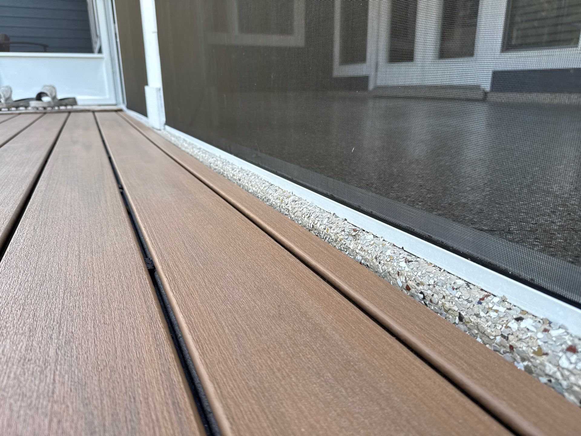 Front and Back Porches in Chiefland, FL in Pebble Beach by Cross Creek Concrete Coatings