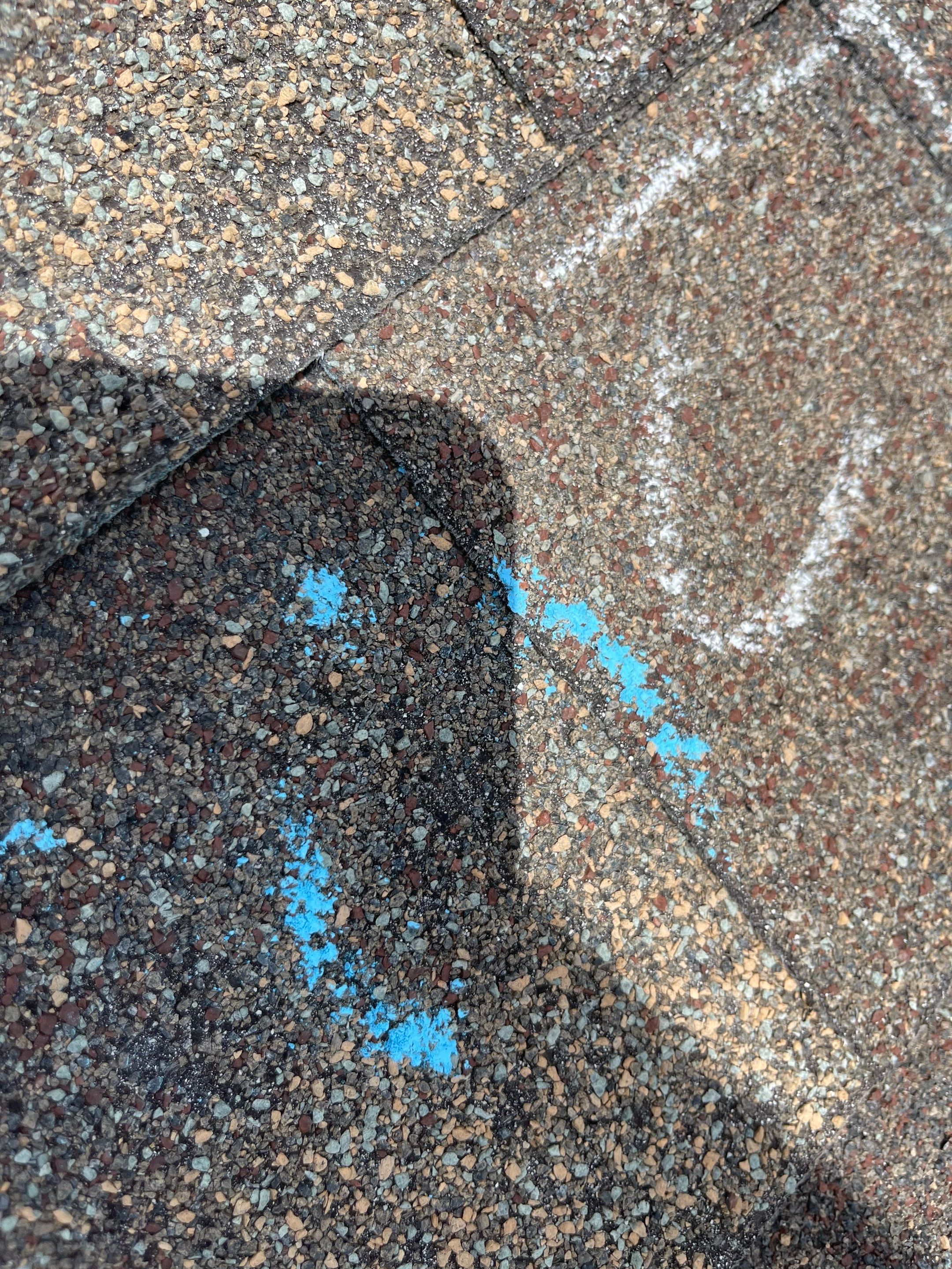 Hail Damage on a Roofing System by Icon Roofing And Construction 