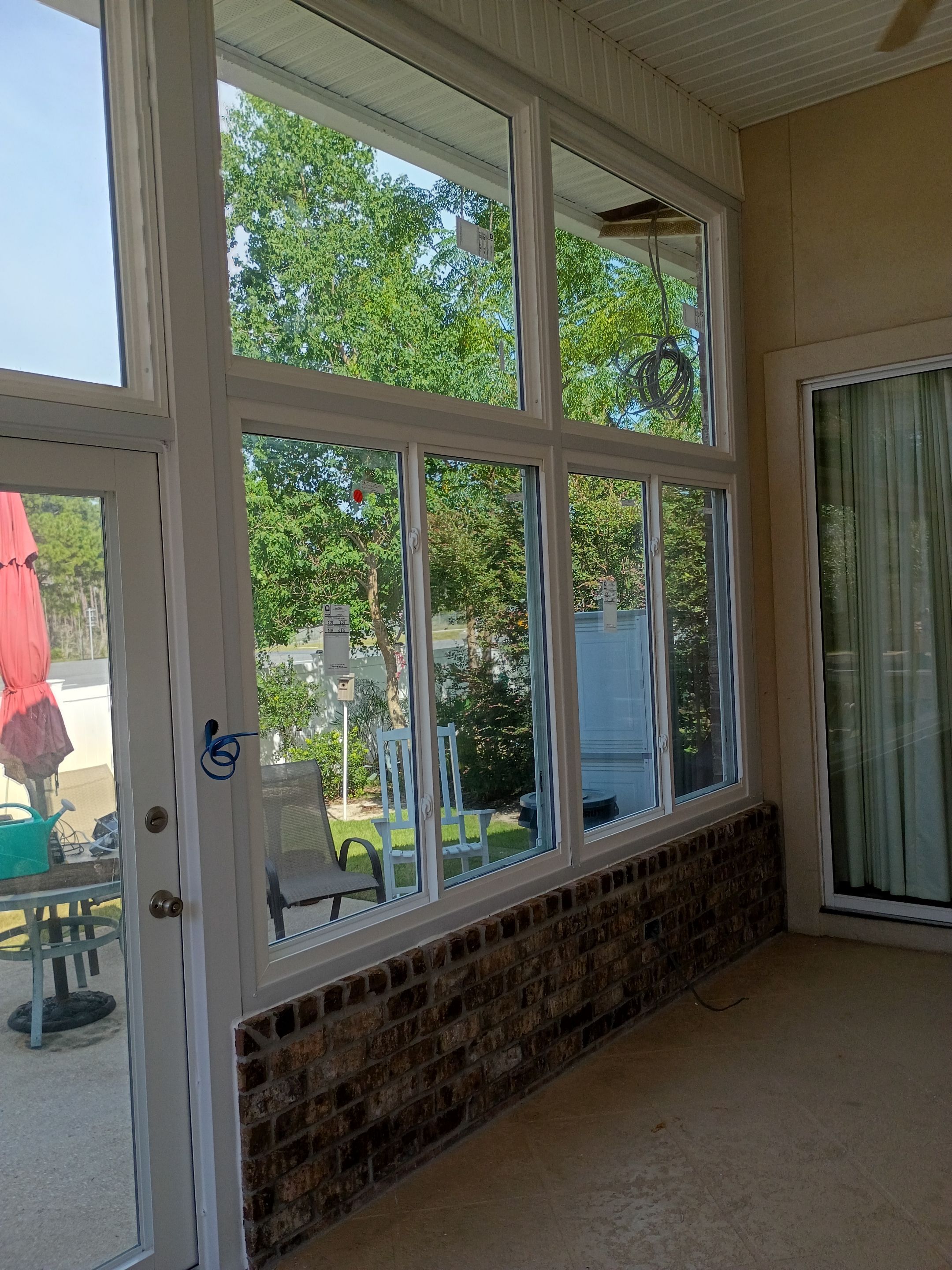 Screen Room Conversion to Glass Under  by Titan Sunrooms