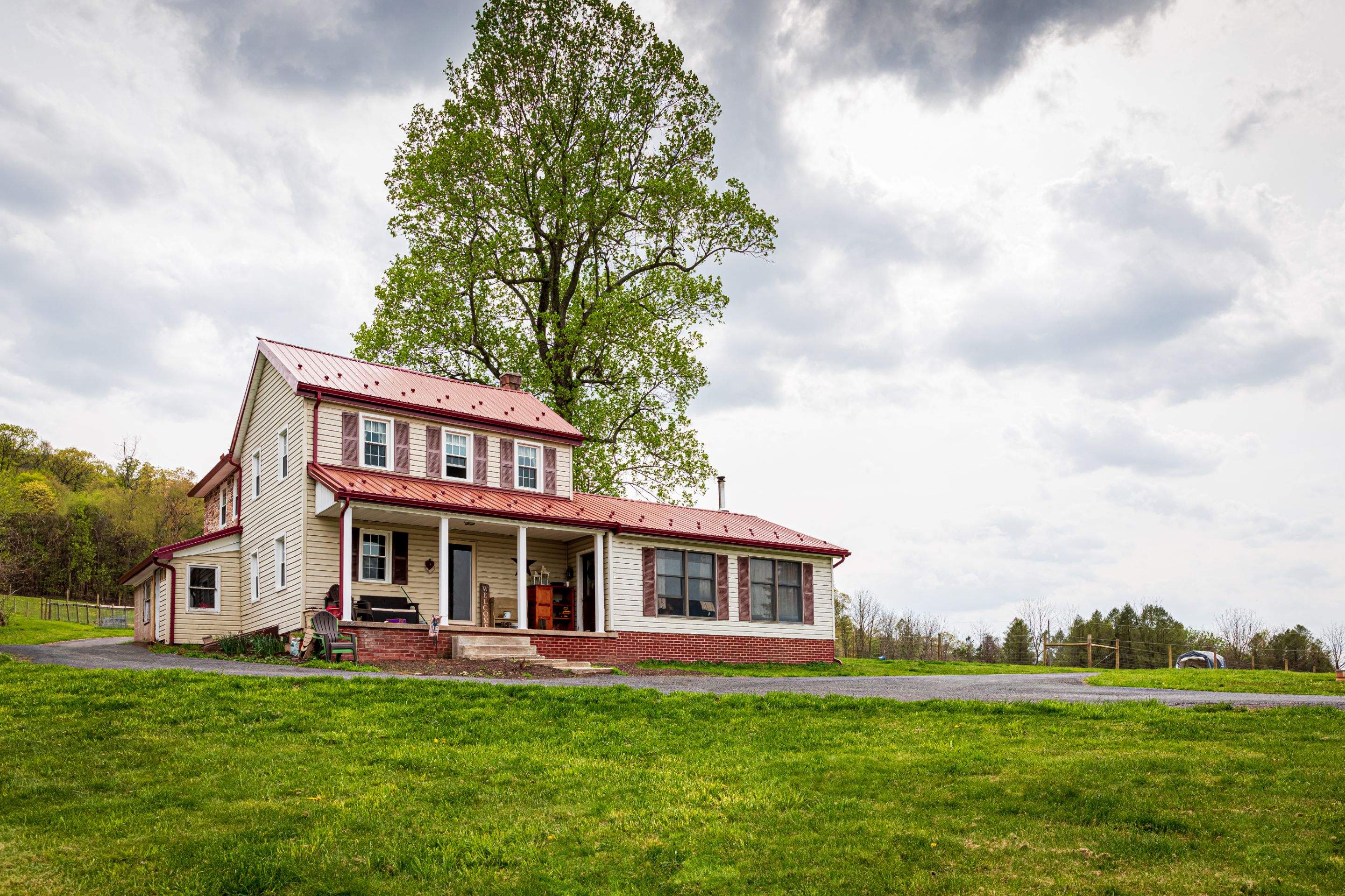 Metal Roof-coloniel red- and new siding by Esh Builders