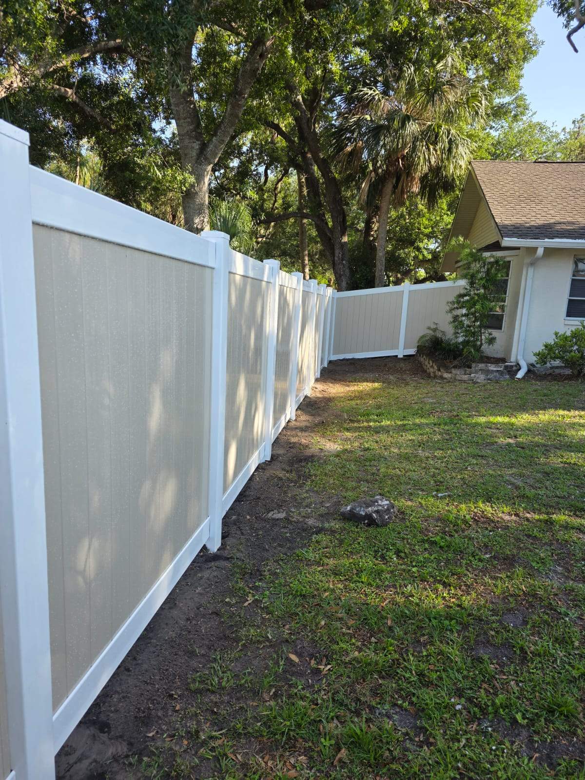 Two-Tone Vinyl Privacy Fence Installation in Port Charlotte by True Fence LLC