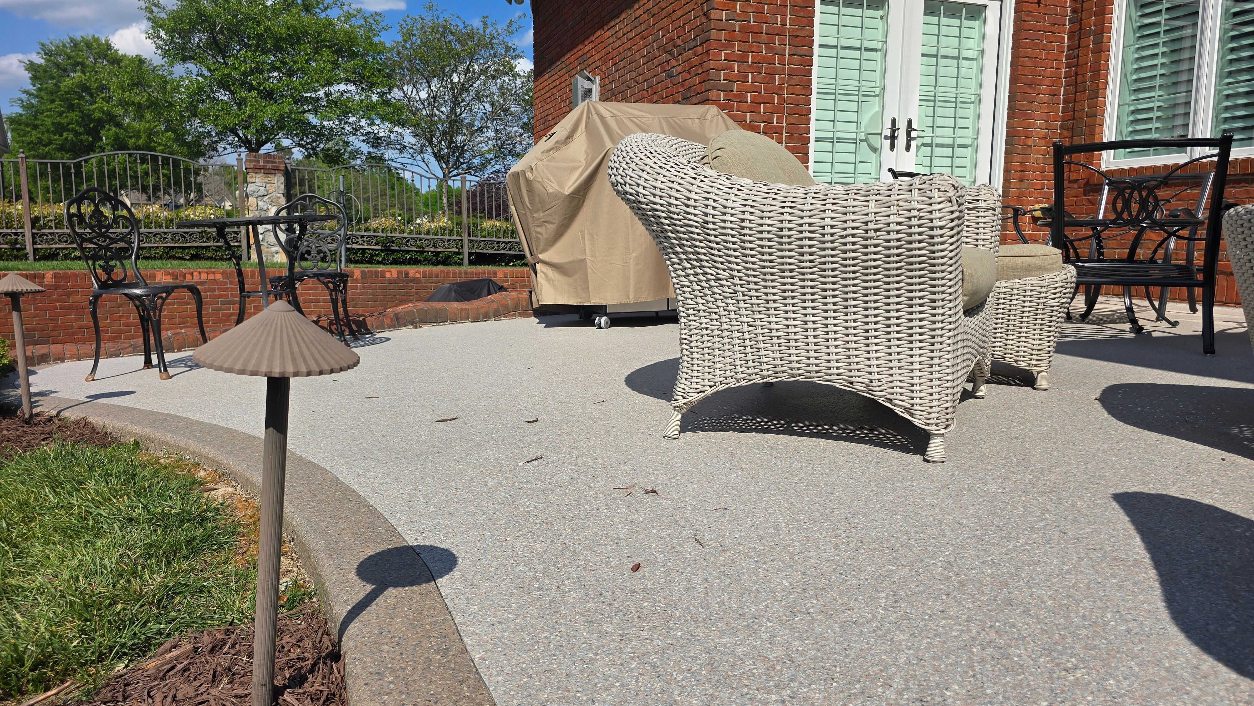 Patio in Pumice with Obsidian Border  by Elite Floor Solutions