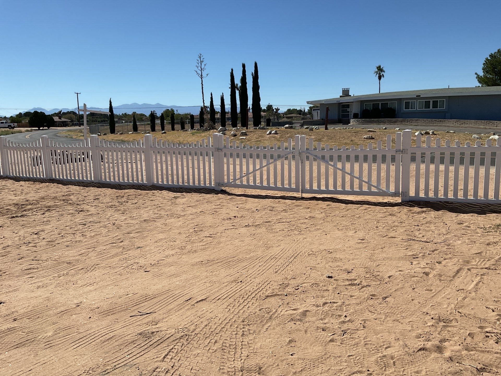 White picket fence  by Fence Guys Inc. 