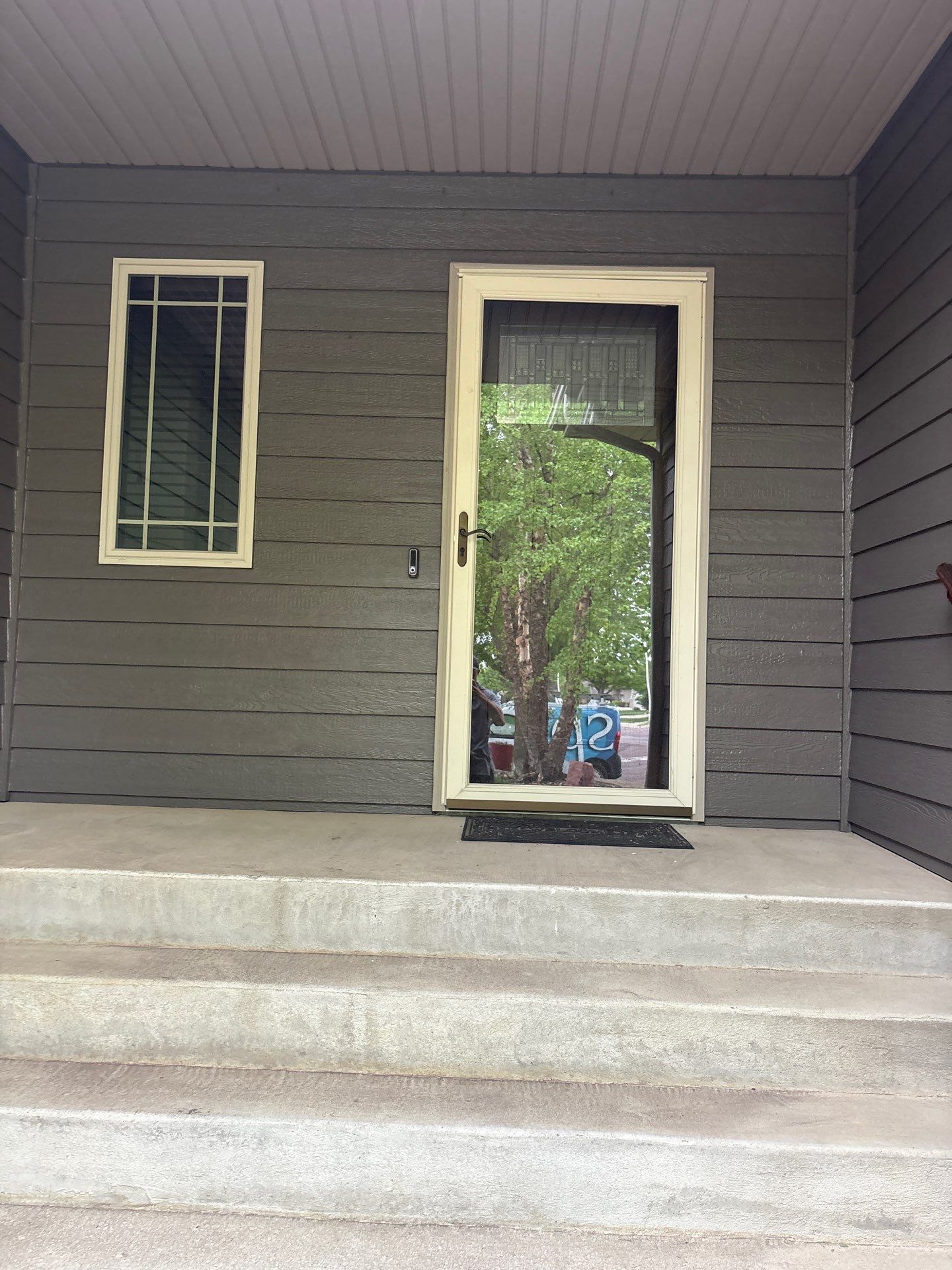 Sioux Falls Residential Exterior Update and Flagstone Pool Deck by Select Painting, Coatings & Garage Cabinets