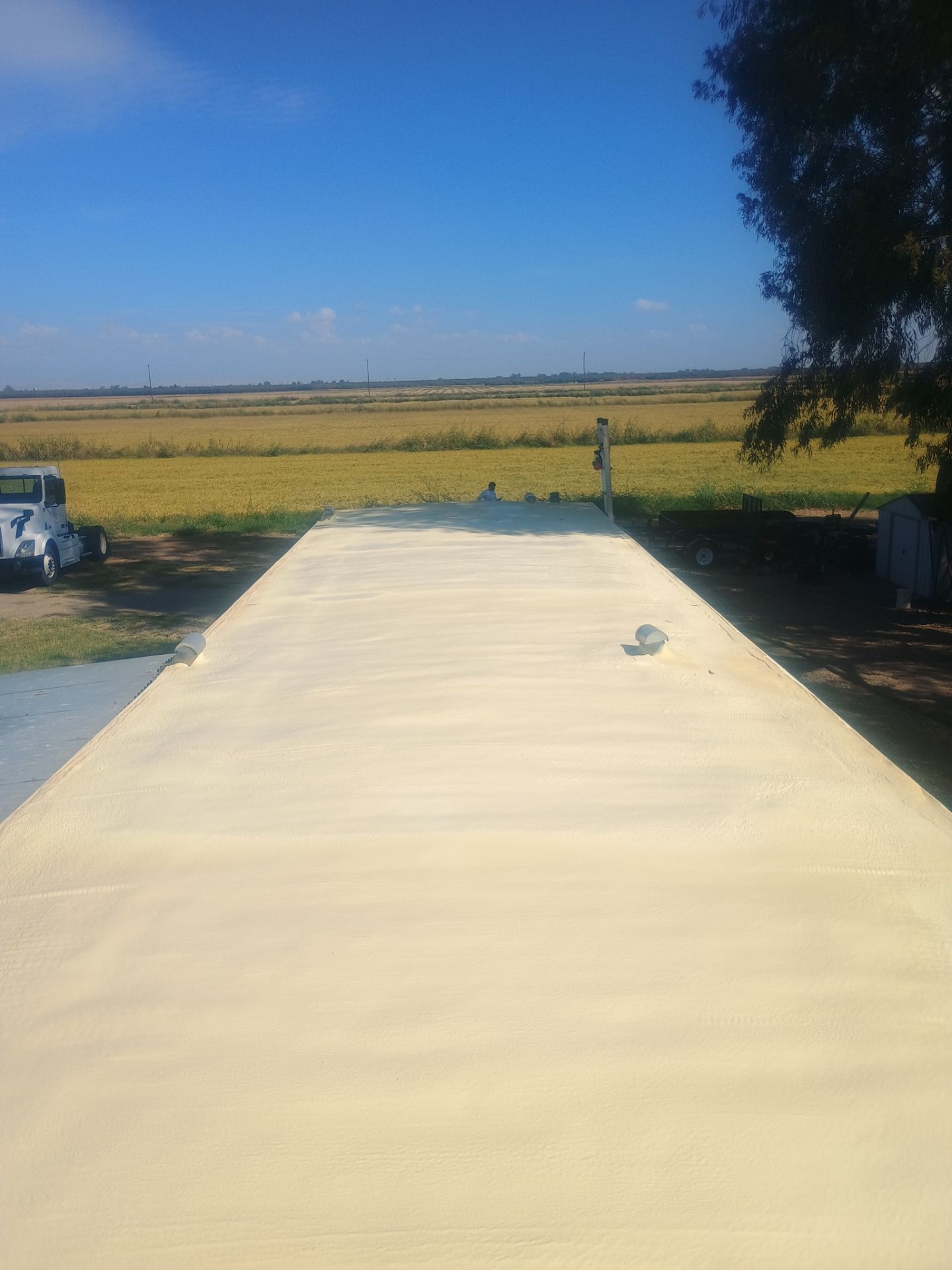 Foam and coatings on mobile home by Straight Edge Roofing Inc