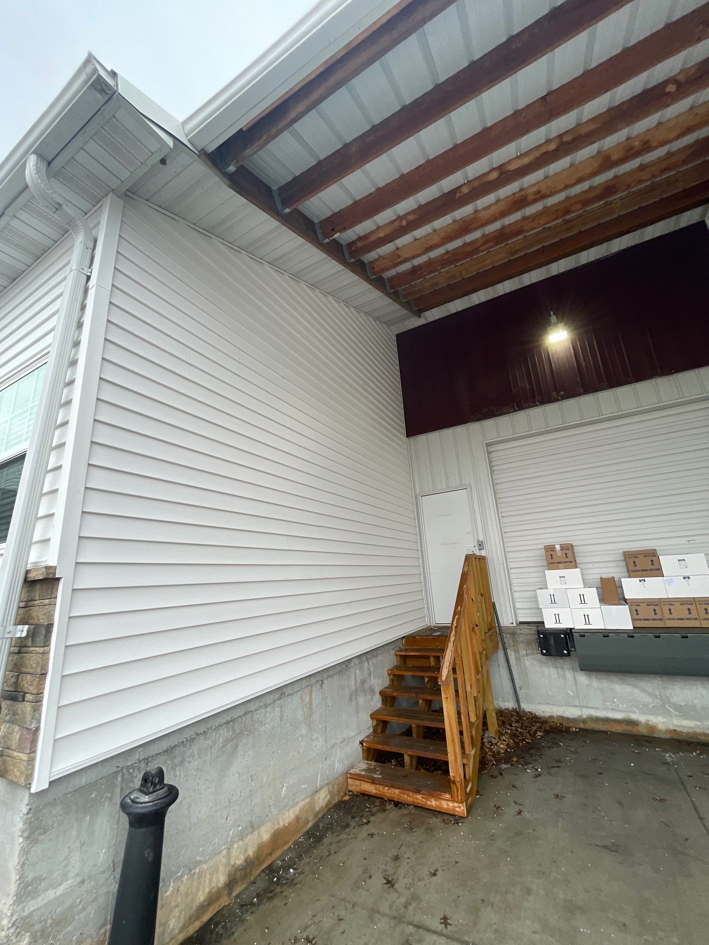 Siding and Stone Installation using Extrerior Porfolio Vinyl Siding and Versetta Stone by EEC  Windows, Siding & Roofing 