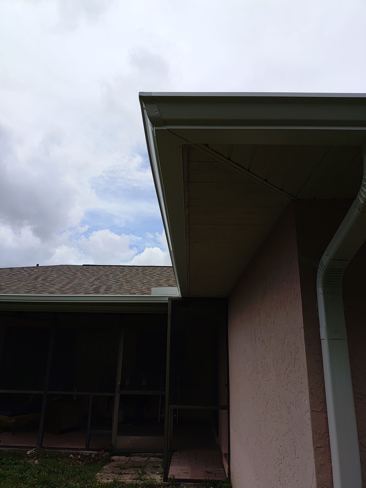 Replace gutter using White Down Spouts in Cape Coral FL by Gutter Professors