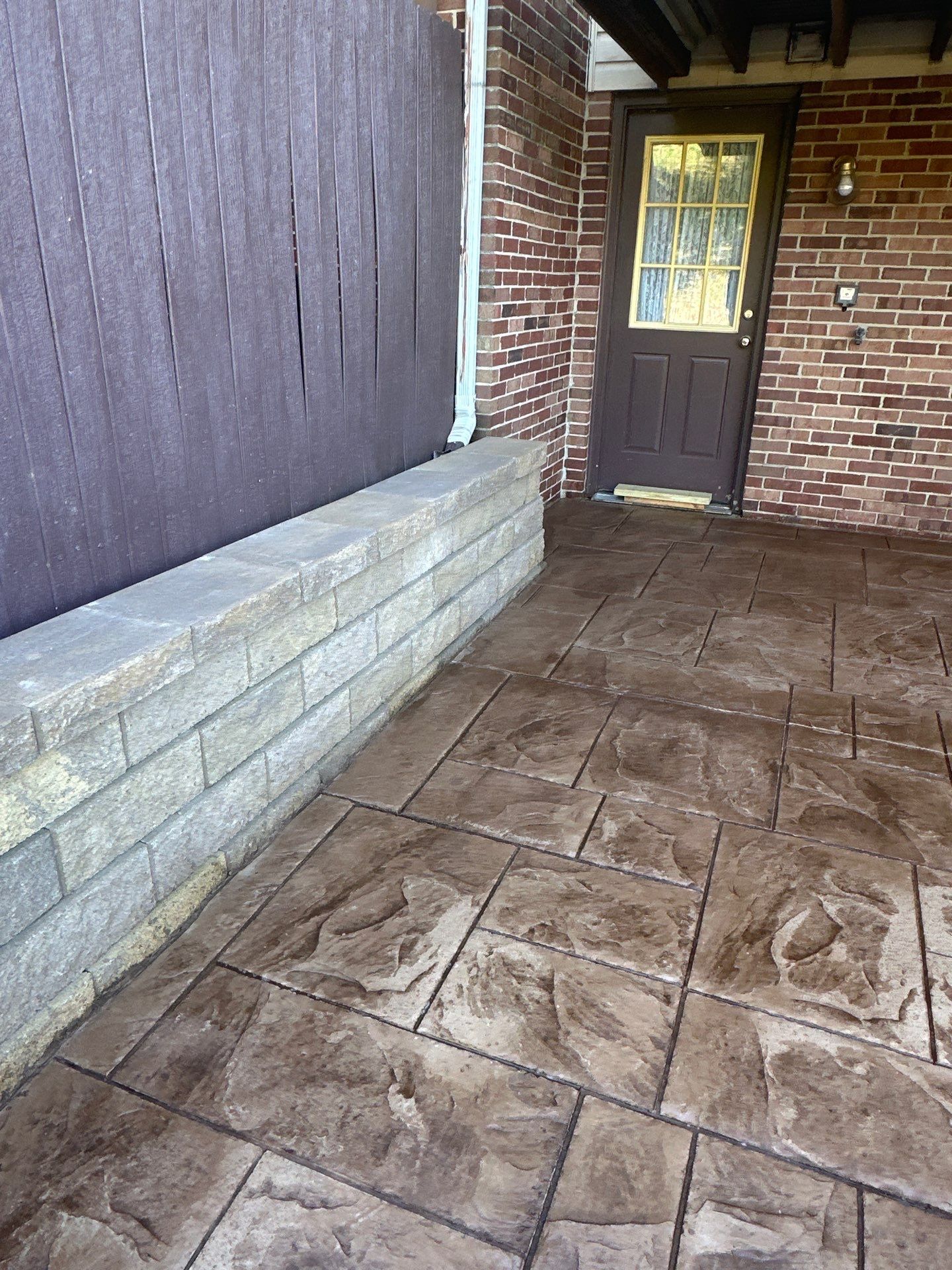 Stamped concrete and redeck  by Cousins Roofing Siding & Decks