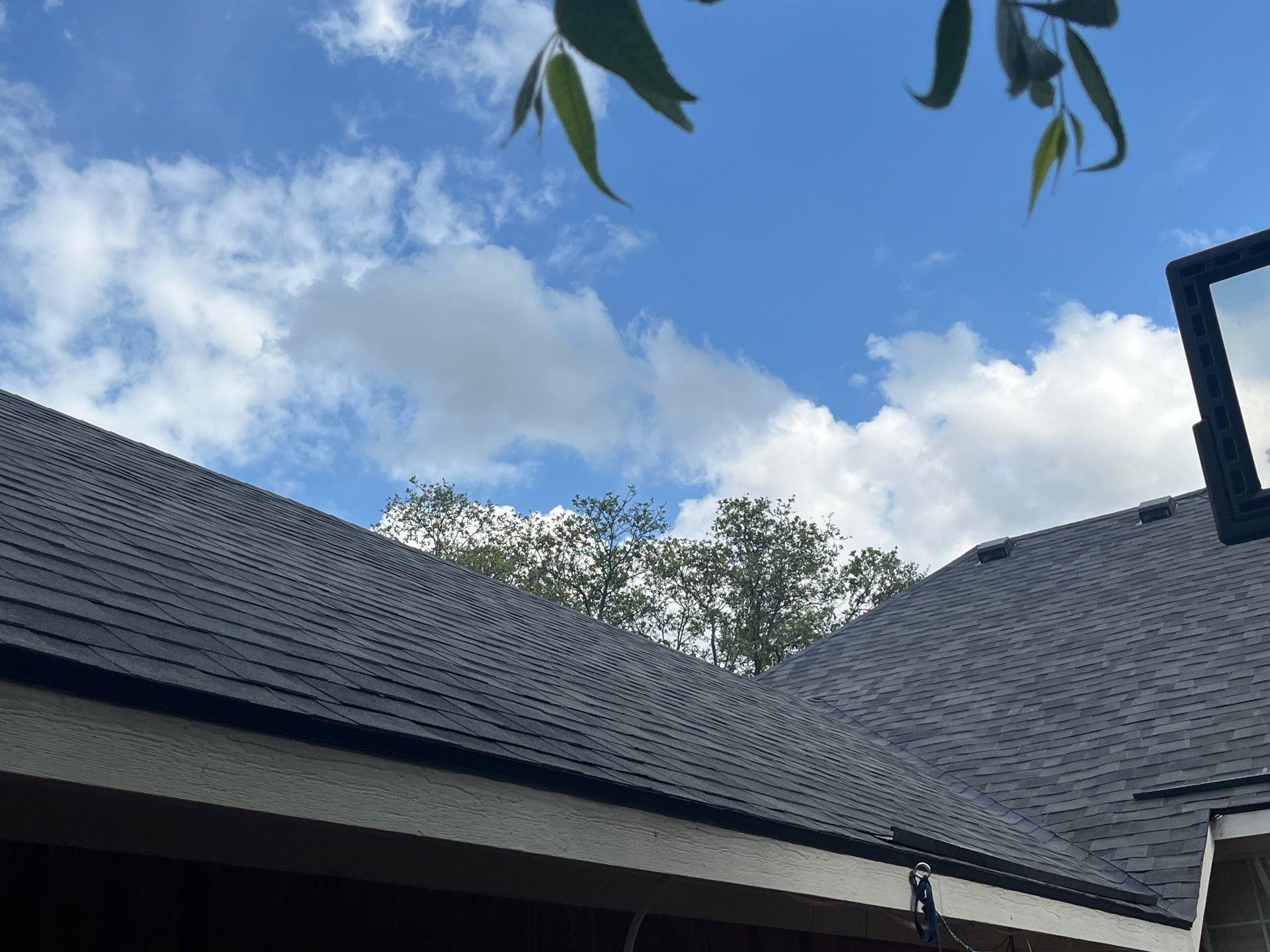 Red brick with Malarkey Midnight Black  by Tejas Roofworks + Restoration