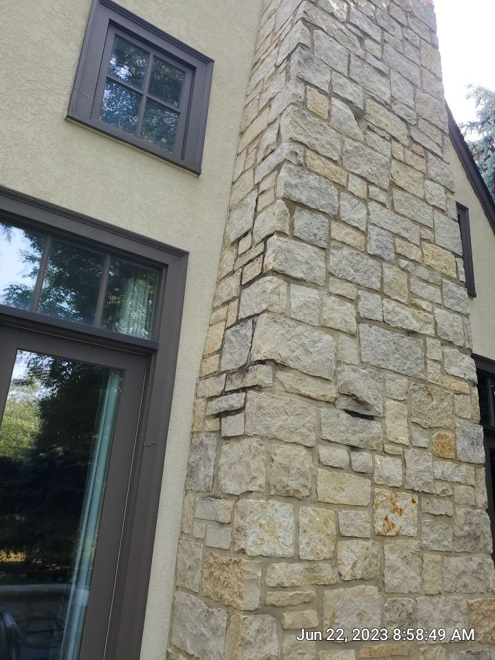 Northbrook, IL stucco home soft wash and stone cleaning by Northern Power Washing LLC.