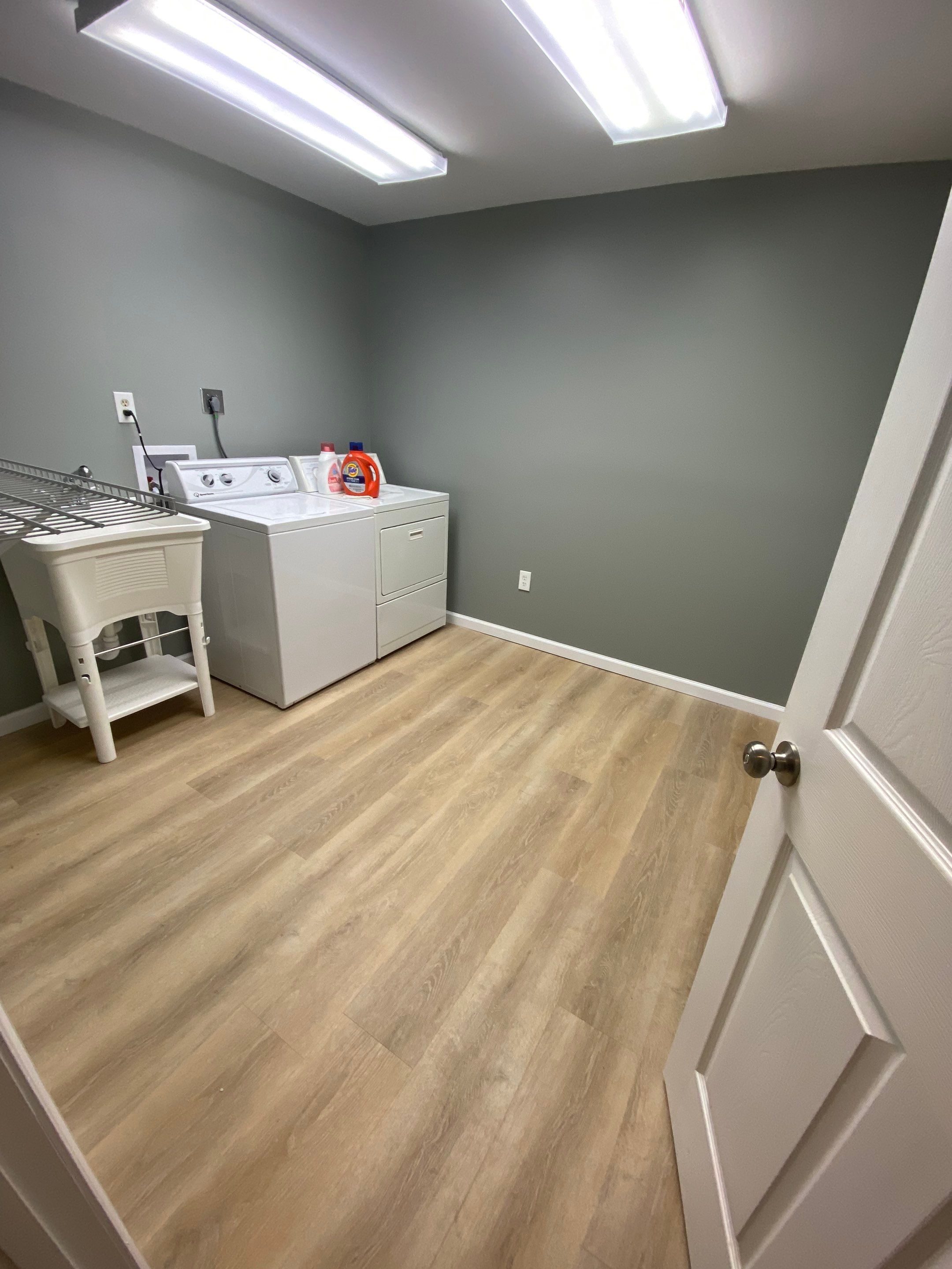 Laundry Room Redmodel using Lifeproof Luxury Vinyl Plank Flooring by The Smet Companies, LLC