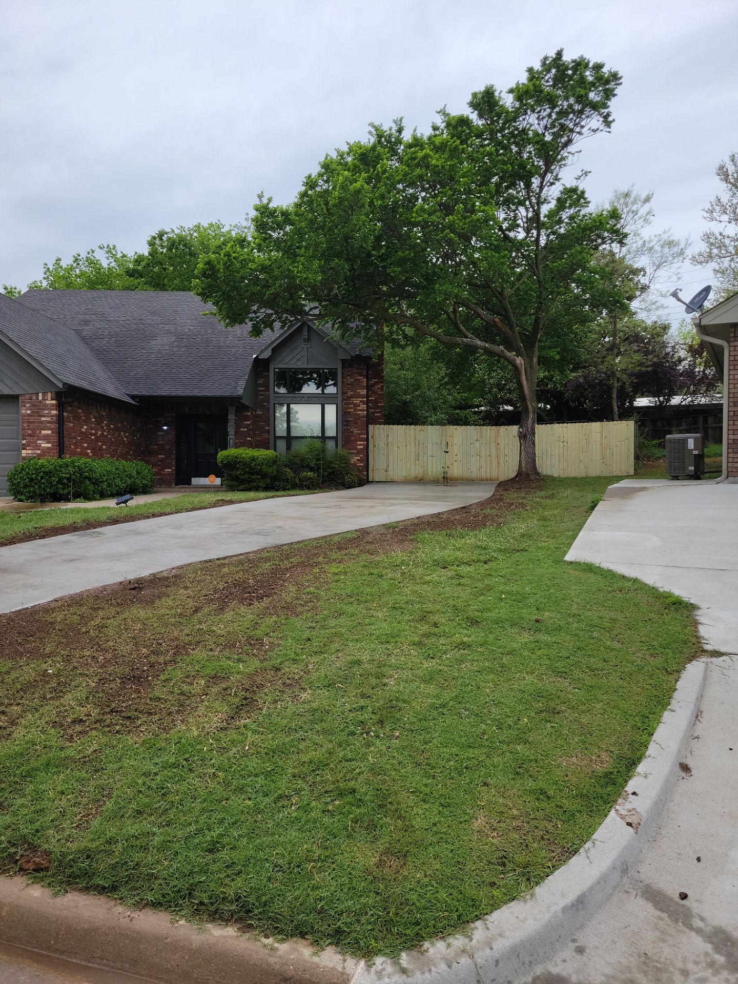 Concrete Driveway and Fence by Clays Services Inc