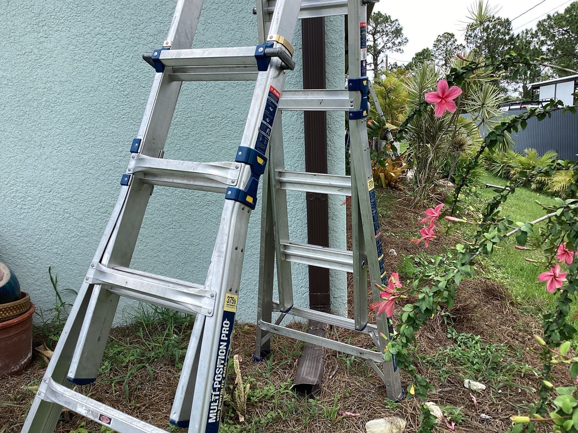 Musket Brown and New Downspouts in Lehigh Acres, FL  by Gutter Professors