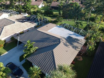 Residential Roofing Installation using 1" Nail strip metal roof