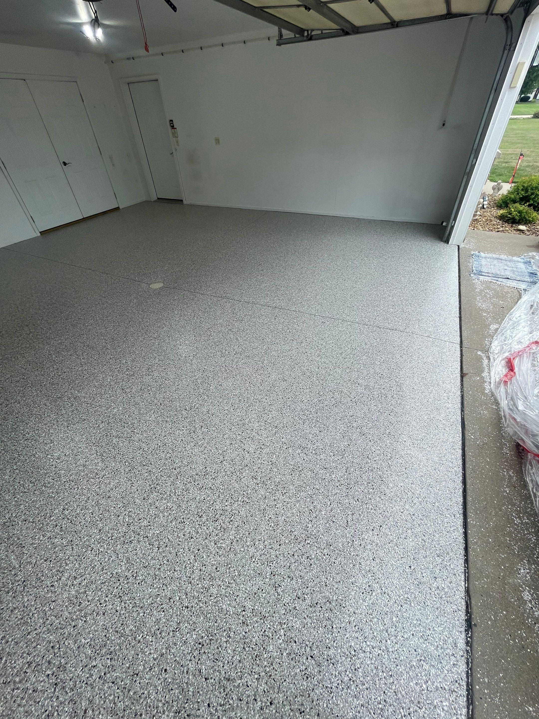 Coyote Flake Garage Floor Coating in Worthington, Minnesota by Select Painting, Coatings & Garage Cabinets