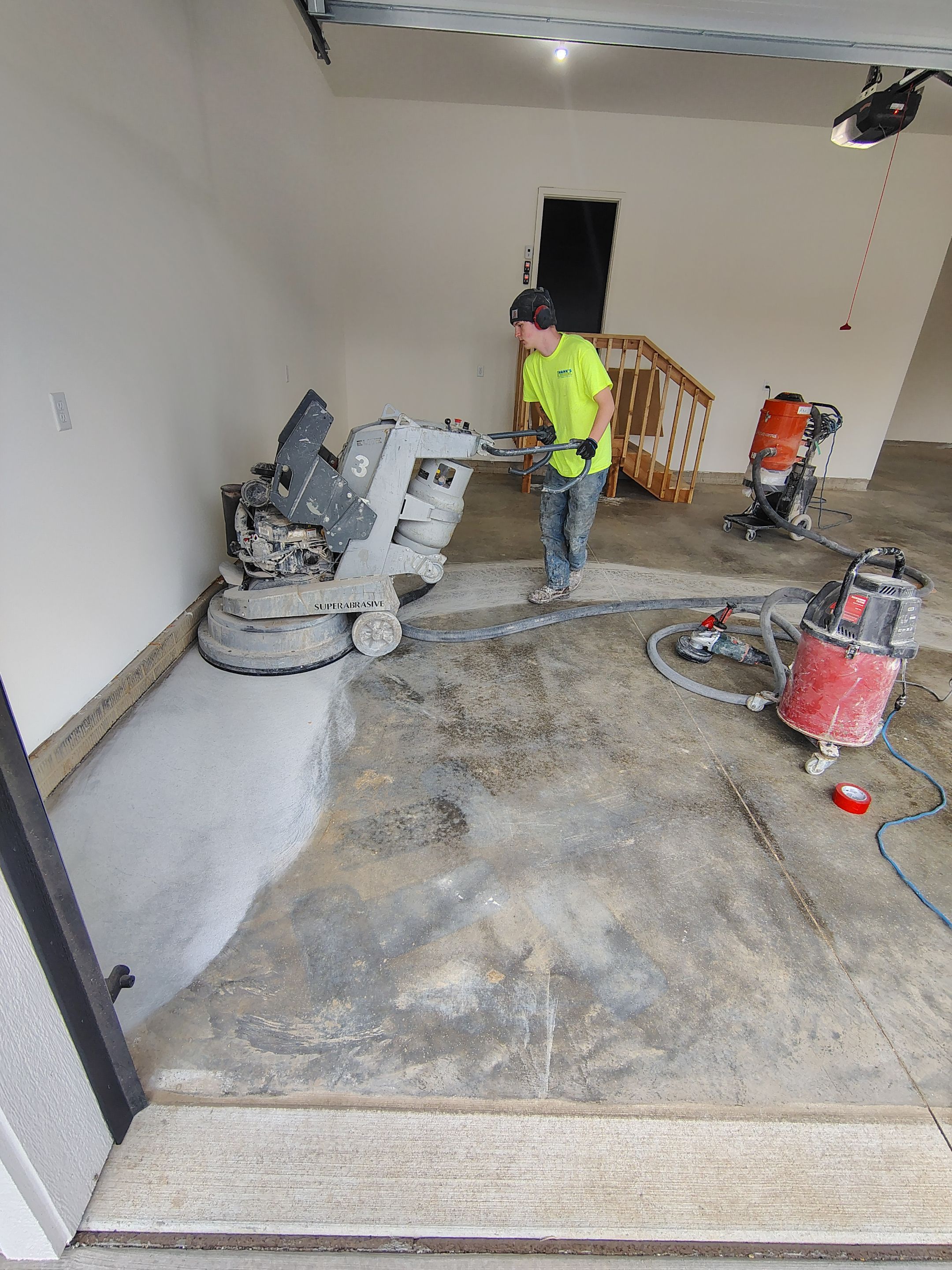 Sioux Falls Garage Floor Transformation with Gray Decorative Flake Coating by Select Painting, Coatings & Garage Cabinets