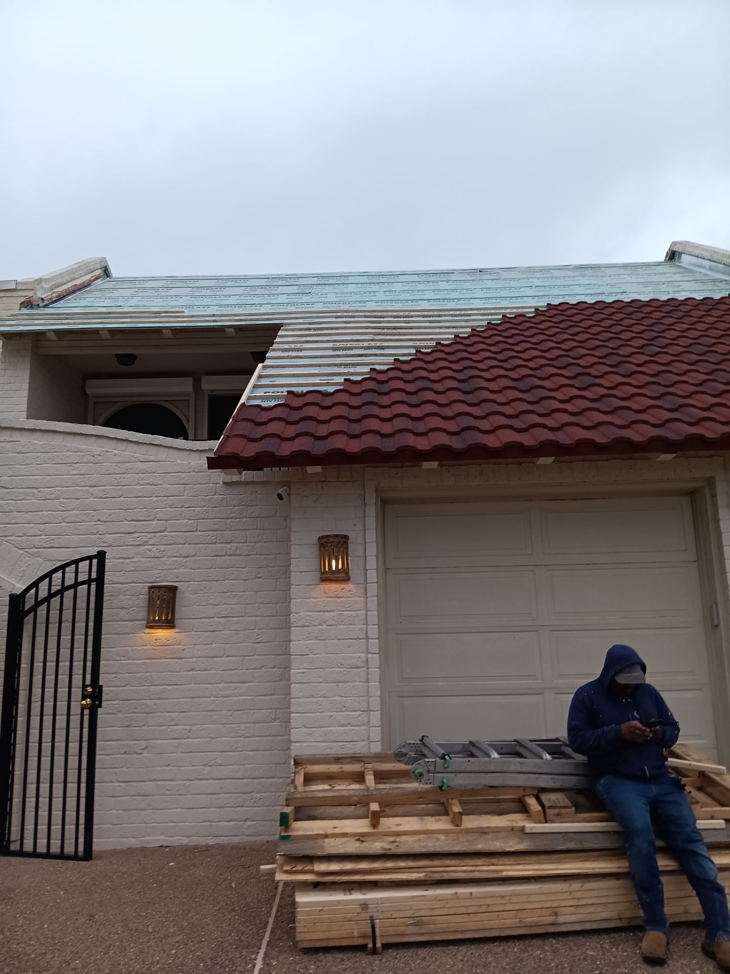 Off with the Tile and on with the TILCOR stone coated metal.  by Bayfront Roofing and Construction