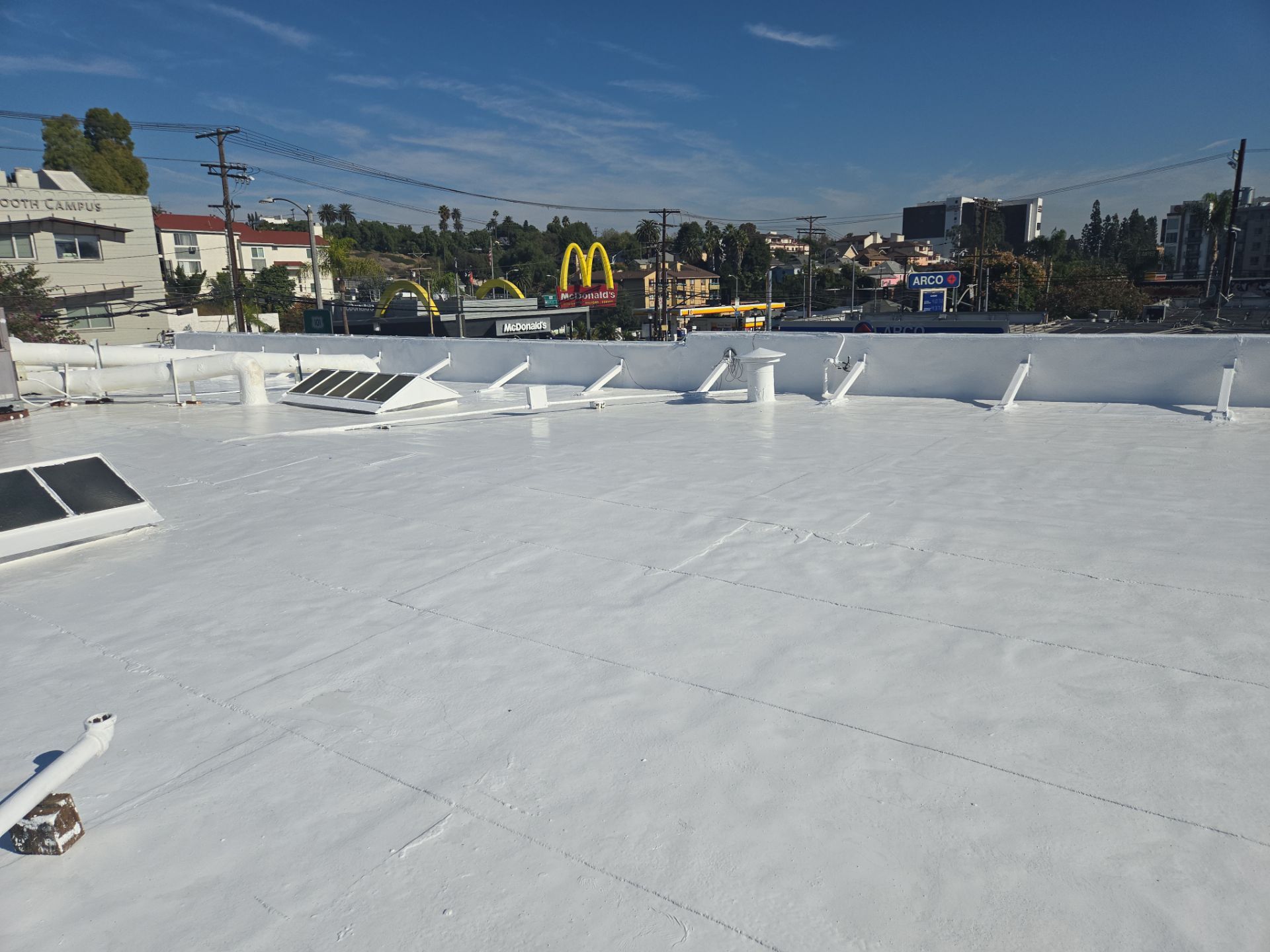 Commercial Roofing Installation using ASC Silicone Membrane by Hull Brothers Roofing