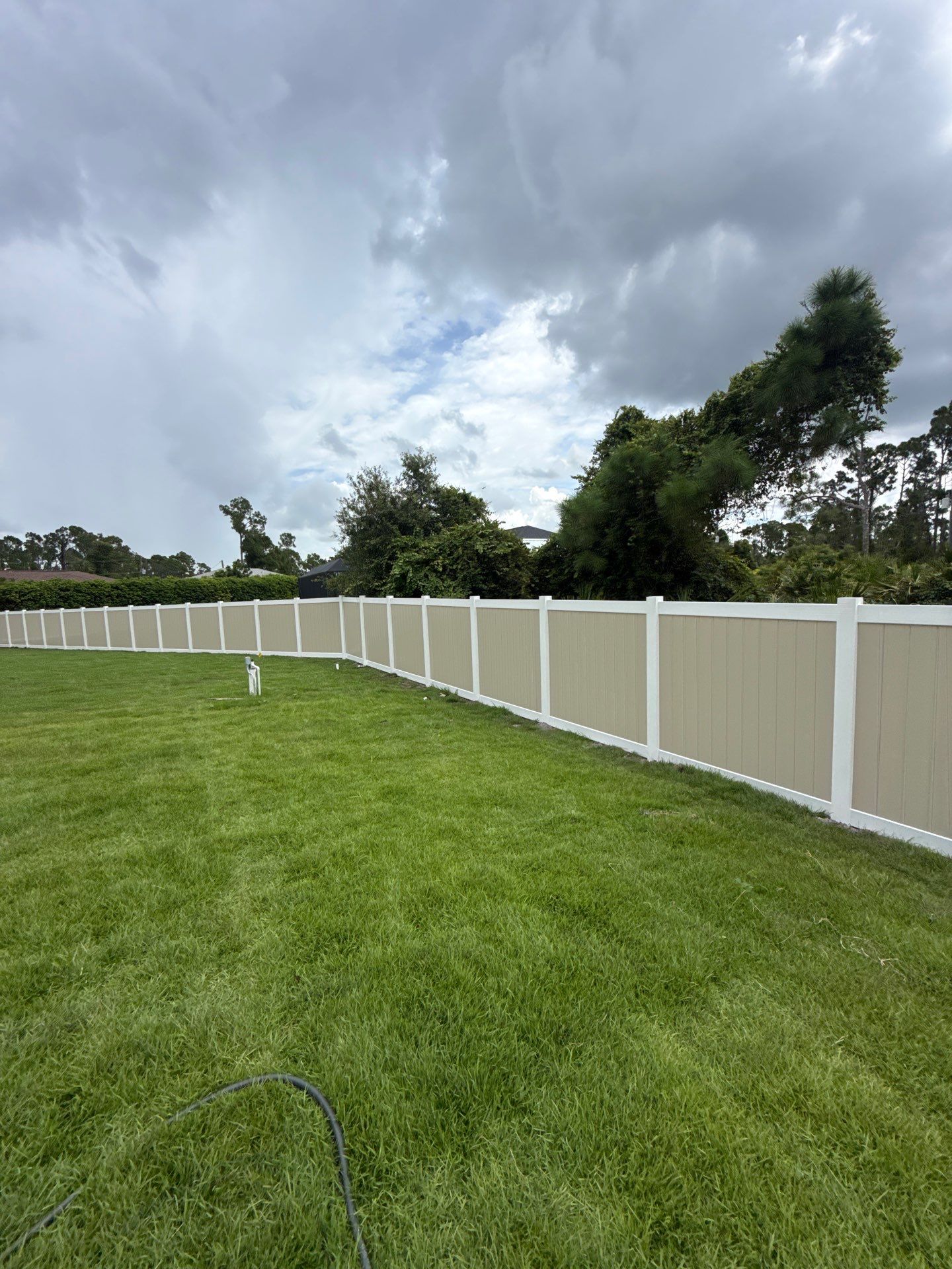 Custom Two-Tone Vinyl Privacy Fence Installation in North Port by True Fence LLC