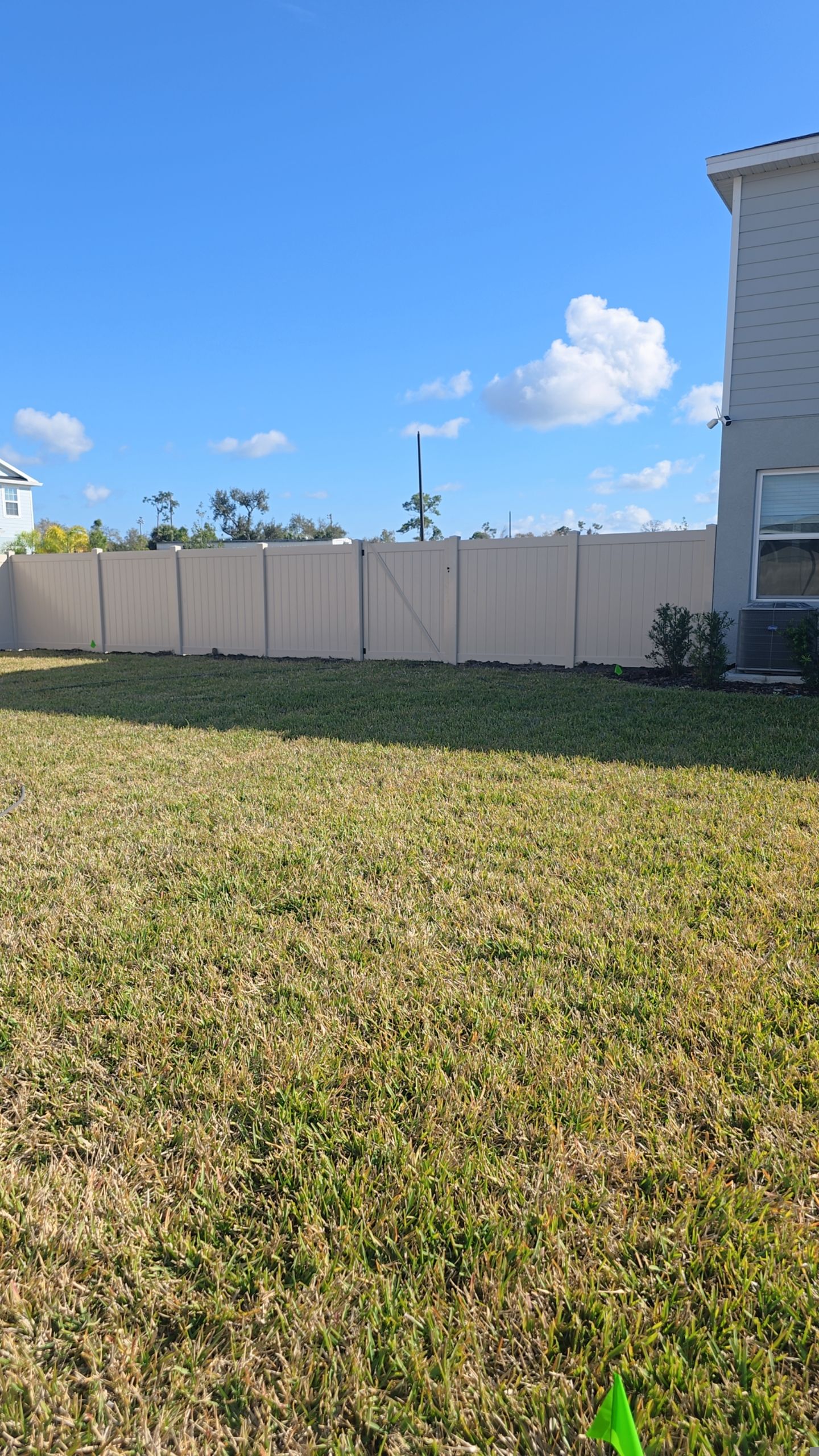 Tan Vinyl Fence in West Port by True Fence LLC