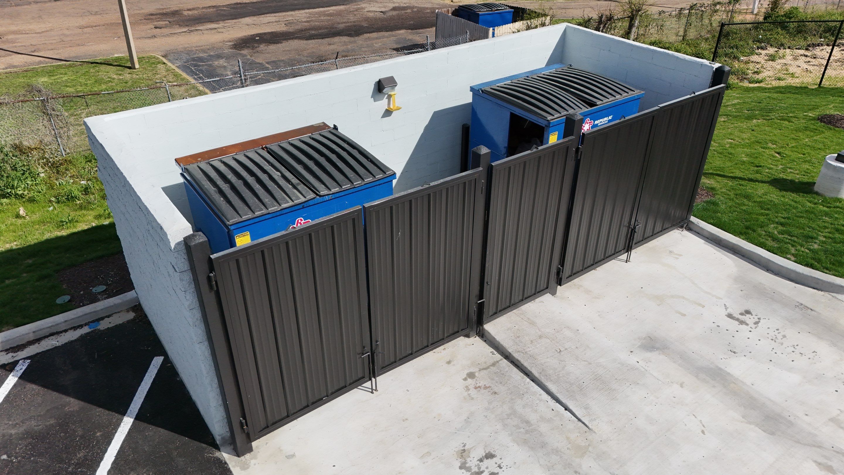 6' Black Chain Link Fence & Concrete Block Dumpster Enclosure by Roberson Construction LLC