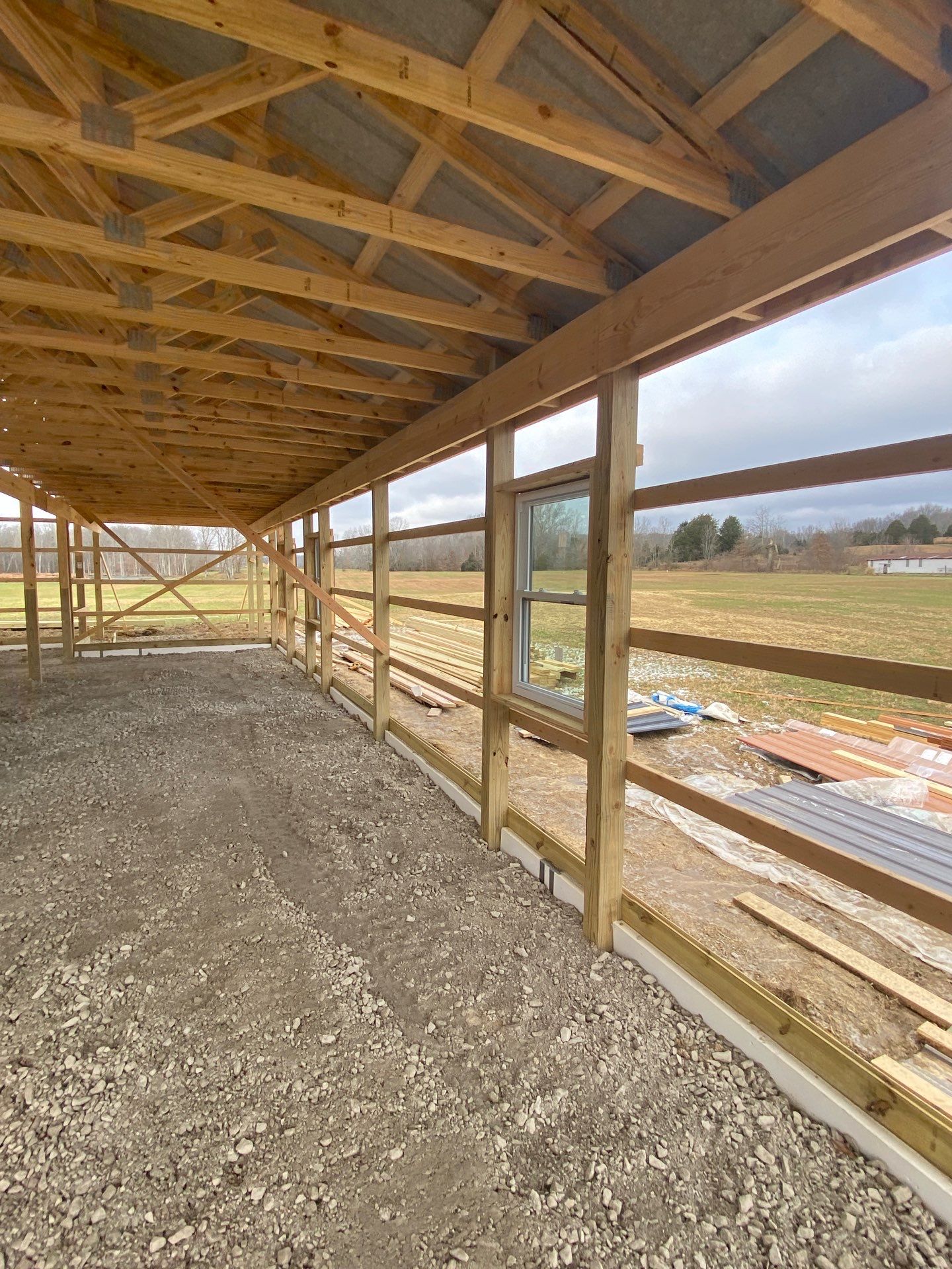 Custom Pole Barn Home with Charcoal Siding and Copper Roof by The Barn Builders