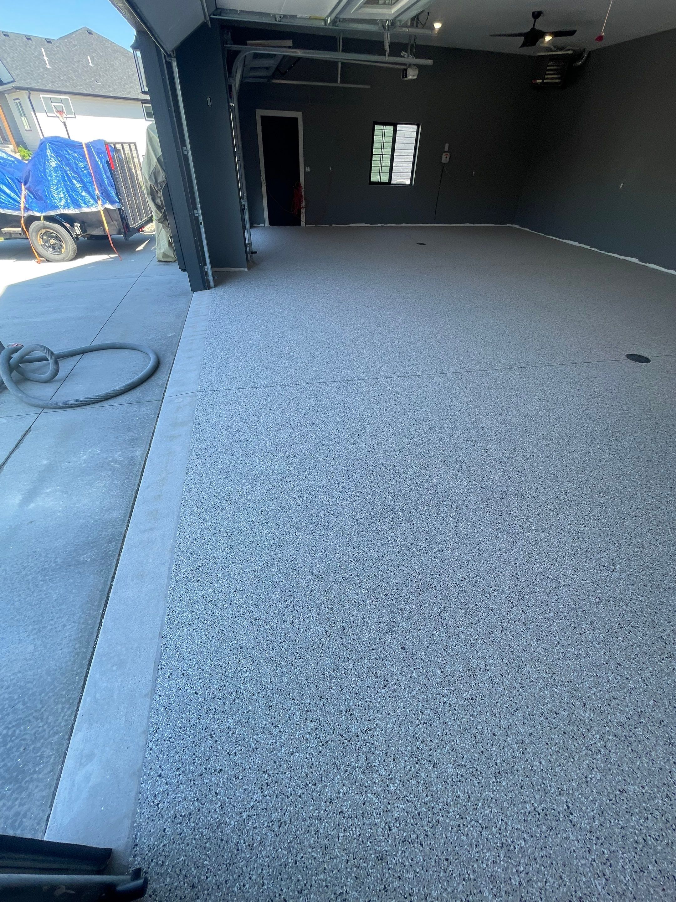 Custom Speckled Concrete Coating for Dell Rapids Garage by Select Painting, Coatings & Garage Cabinets