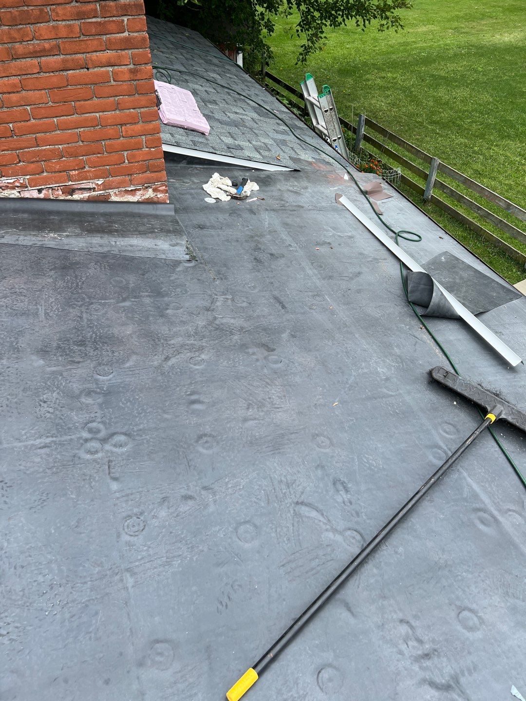Residential Roofing Installation using 60 mil rubber roof  by Nitro Roofing and Construction
