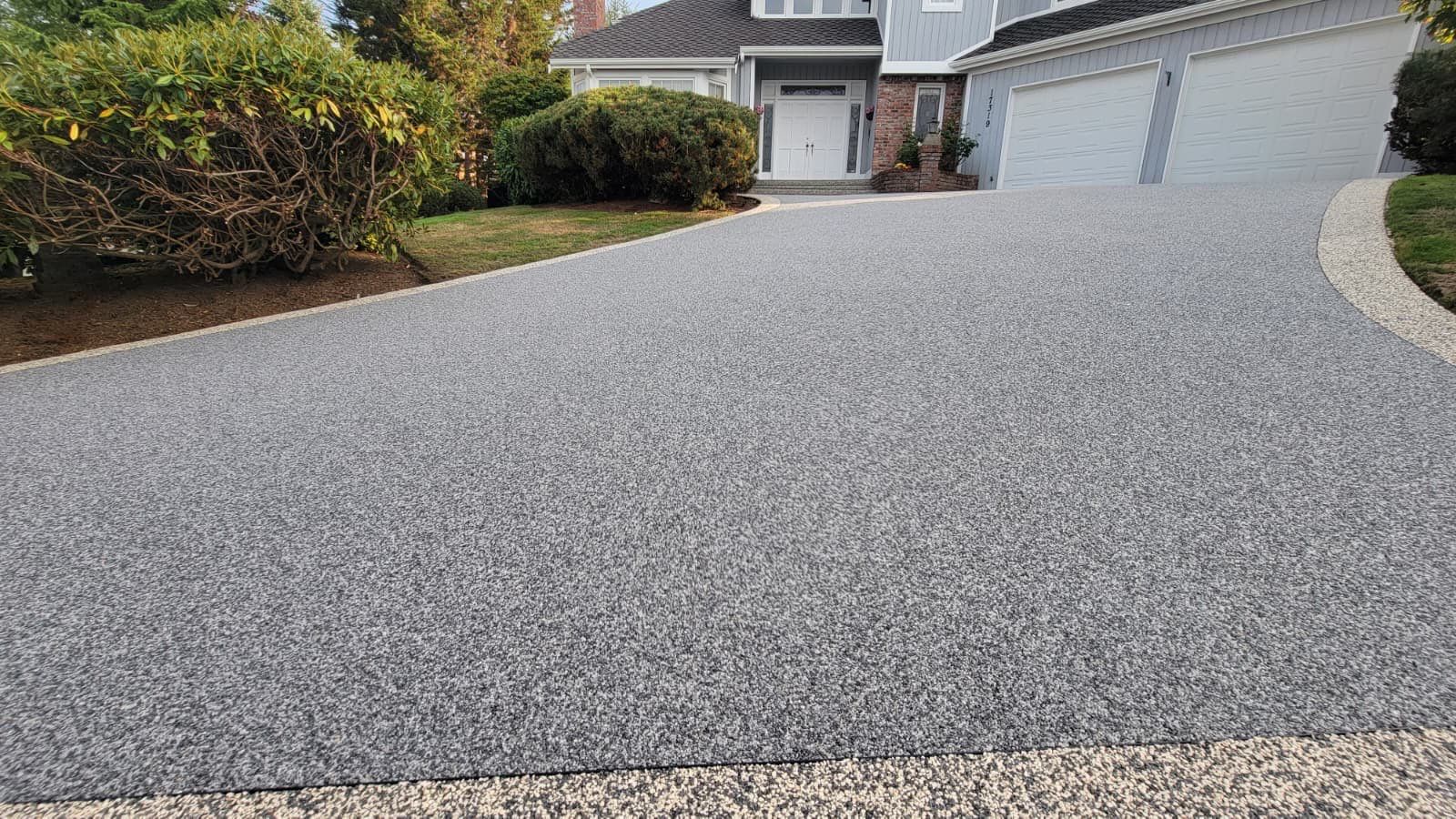 Elegant Driveway and Patio in Palazzo Vuba Stone by Concrete Coating Experts Inc.