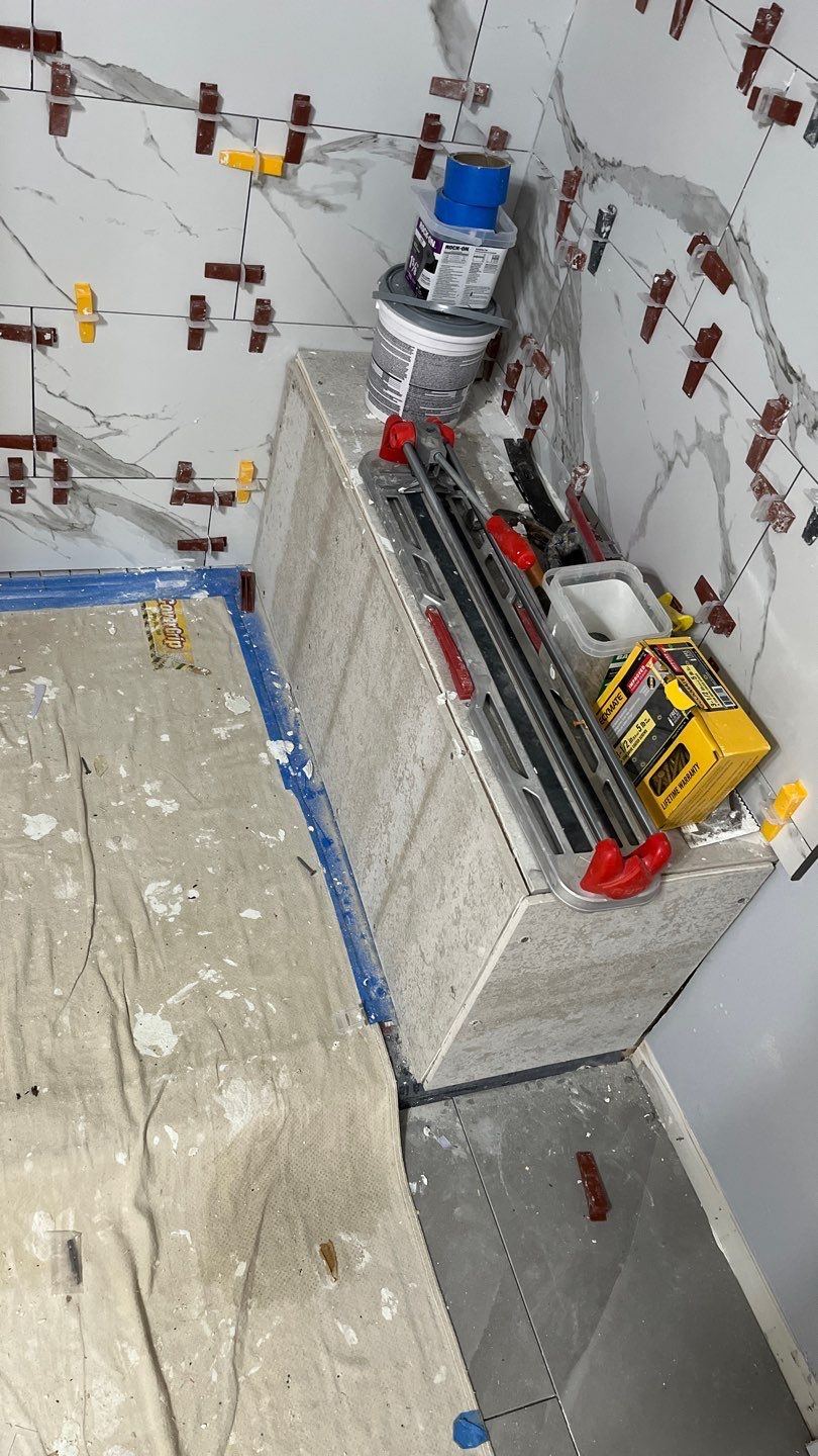 Tub to walk-in shower conversion, and tile flooring by Prudencio