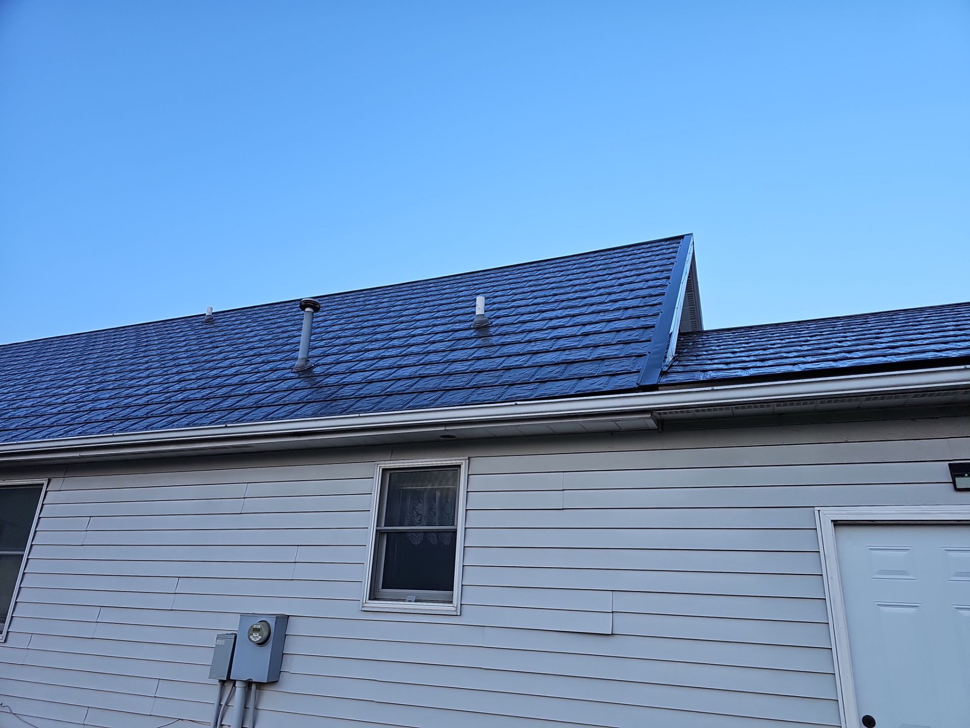 Residential Roofing Installation using Metstar Slate Plus Smooth Black by Nitro Roofing and Construction