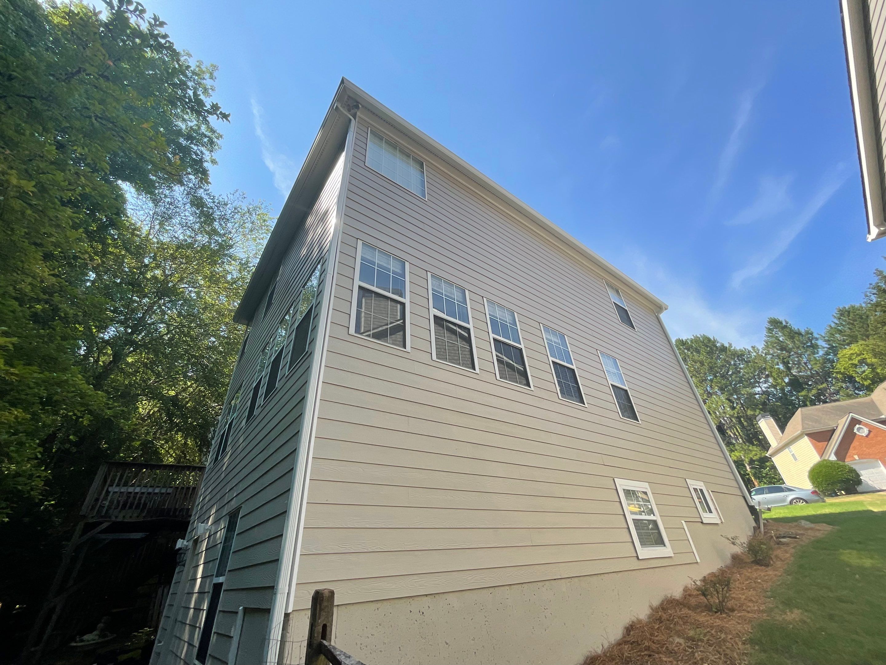 Stucco and Siding Exterior Painting with New Gutters in Kennesaw by Swift Home Renovations