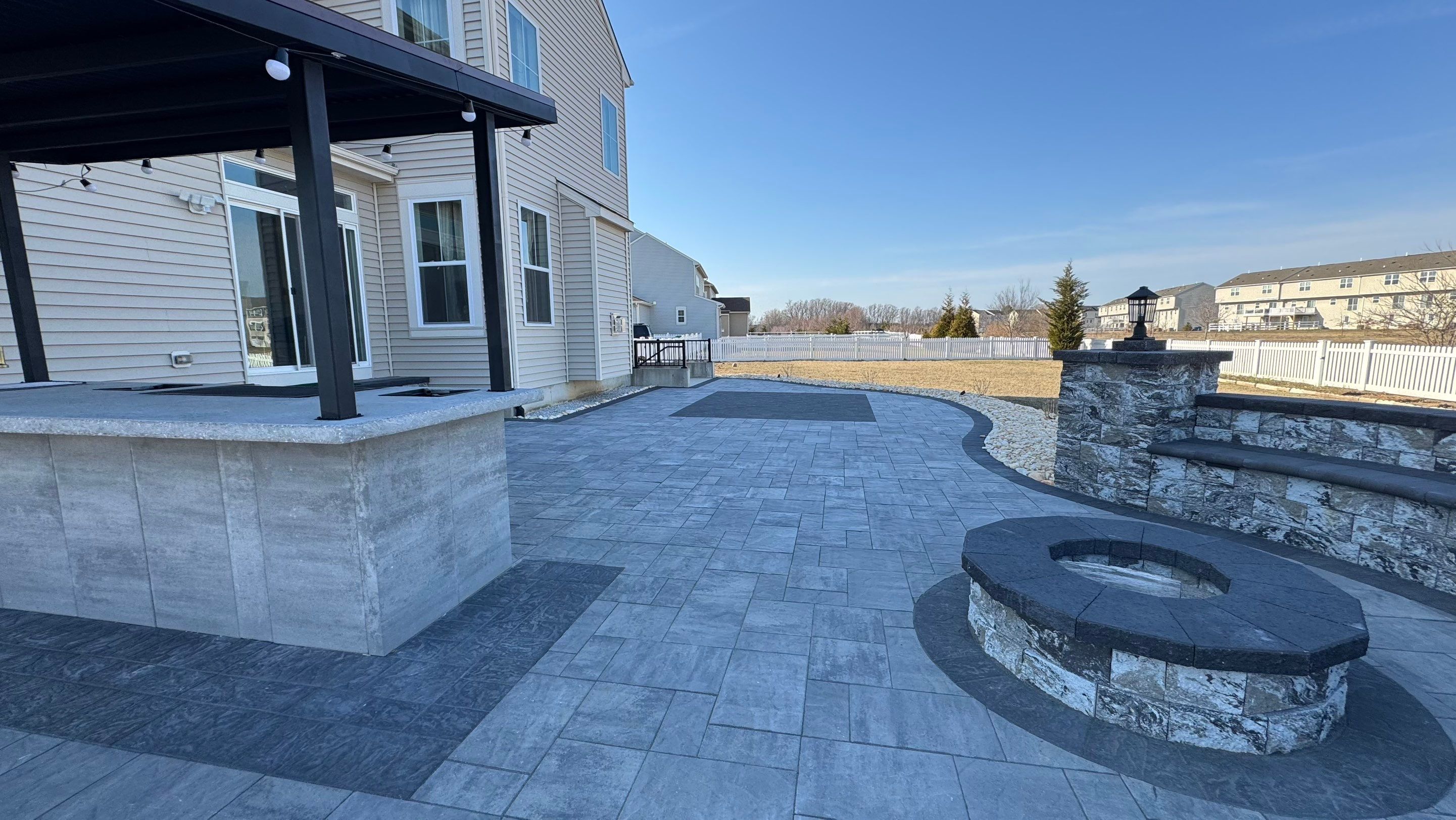 Custom Belgard patio by Studio G Indoor Spaces & Outdoor Living
