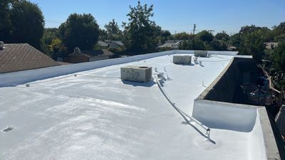 Foam Refurbish using Conklin Benchmark/PUMA XL coatings and spray foam; Also metal roofing around parapet wall