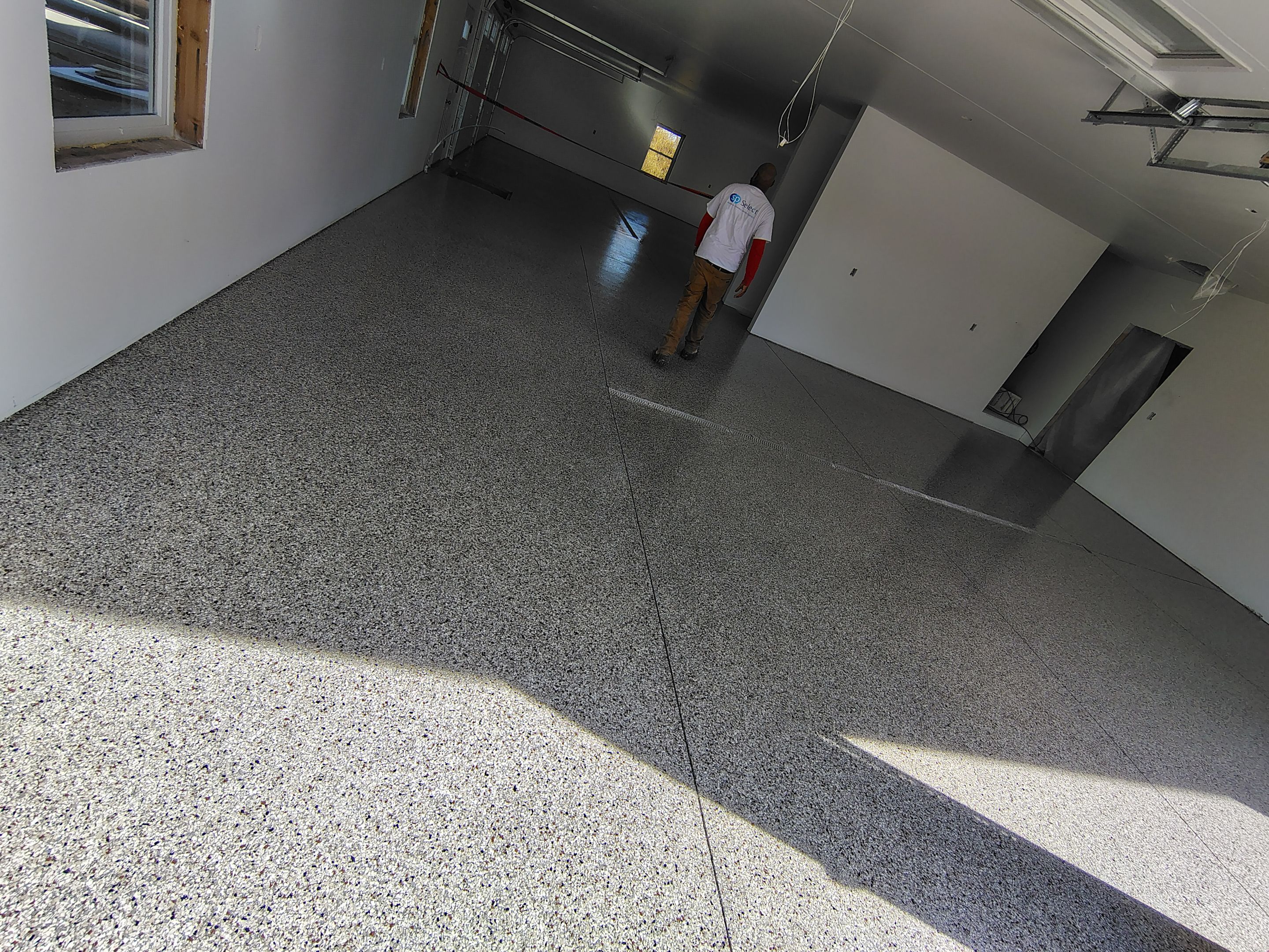 Custom Garage and Basement Epoxy Floor Coating in Menno by Select Painting, Coatings & Garage Cabinets