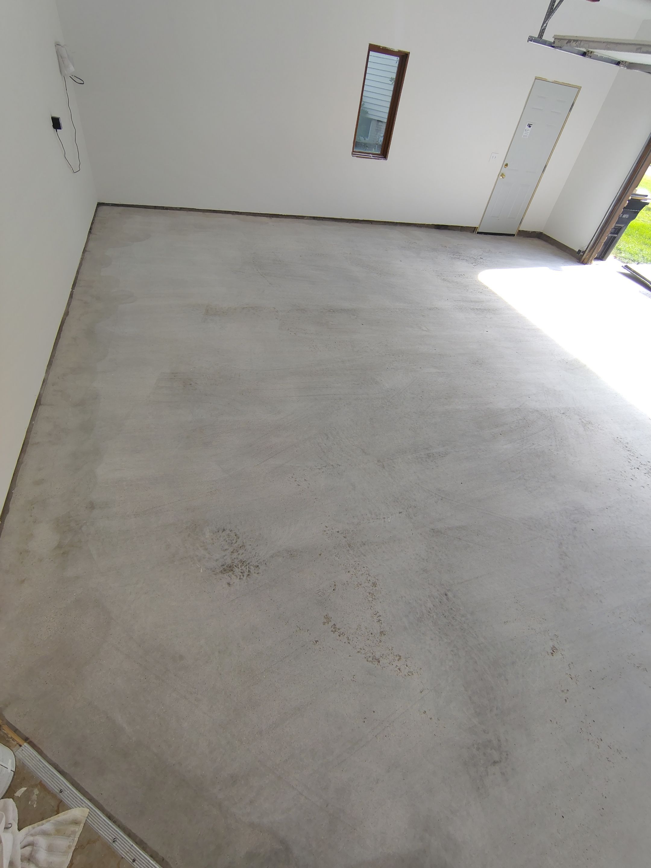 Sioux Falls Garage Floor Coating with Speckled Flake Finish by Select Painting, Coatings & Garage Cabinets