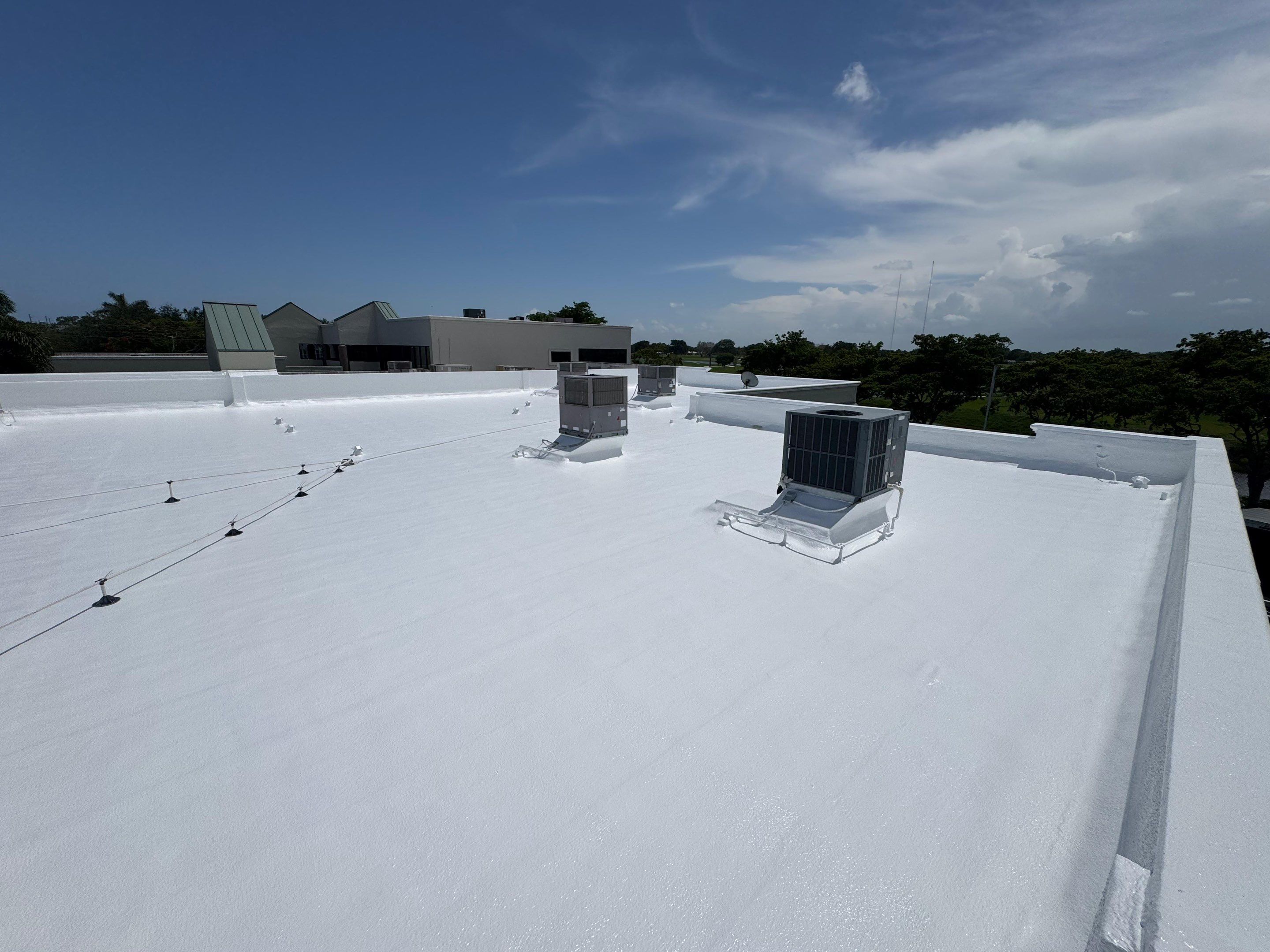 Commercial Flat Roof Restoration and Elastomeric Waterproofing in Delray Beach by Roof King LLC
