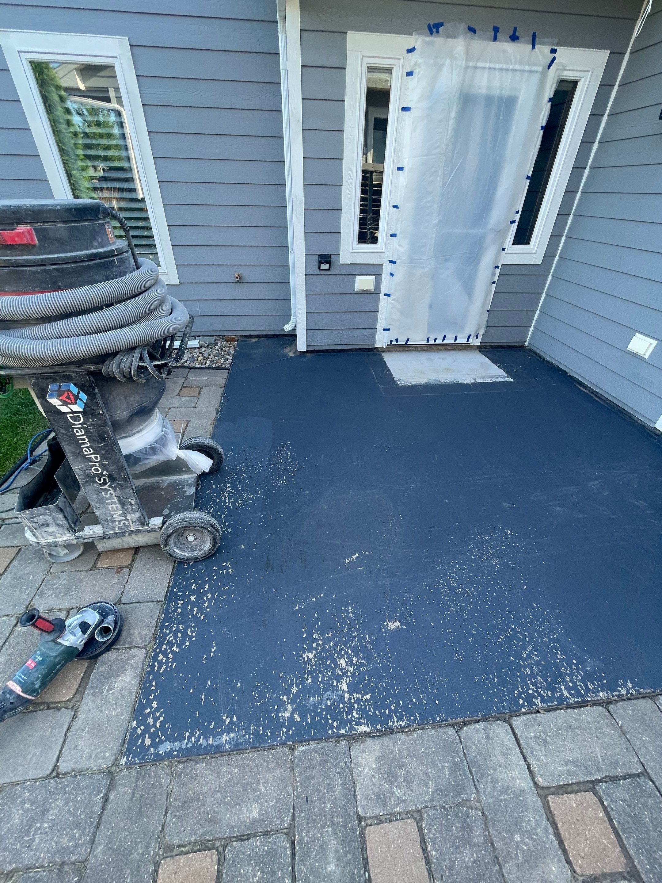 Concrete Patio Coating with Fuzzy Wool Finish in Sioux Falls by Select Painting, Coatings & Garage Cabinets