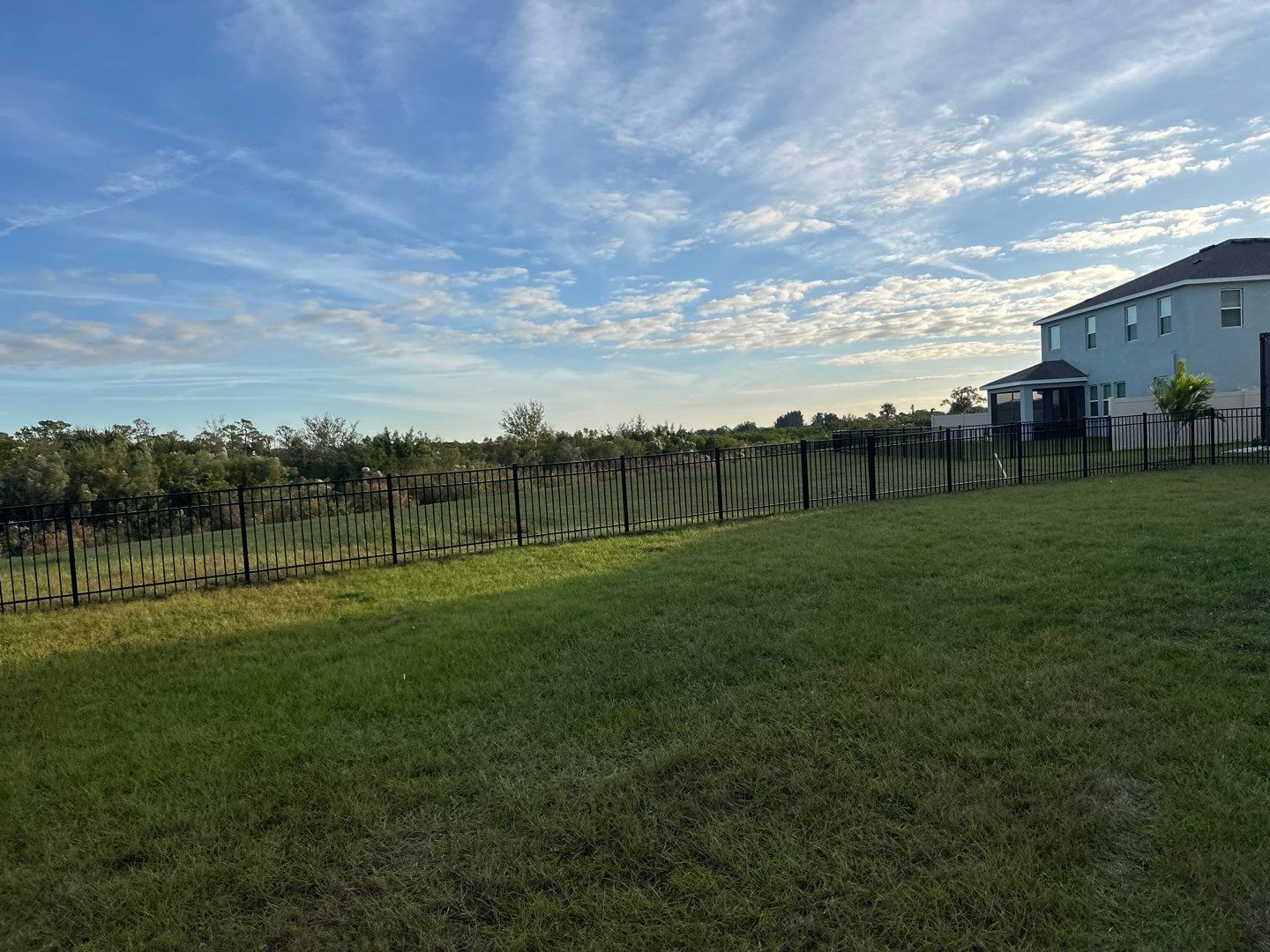 Vinyl Fence Installation using Vinyl Fence and a Black 3 Rail Aluminum Fence by Asap fence and gates, LLC
