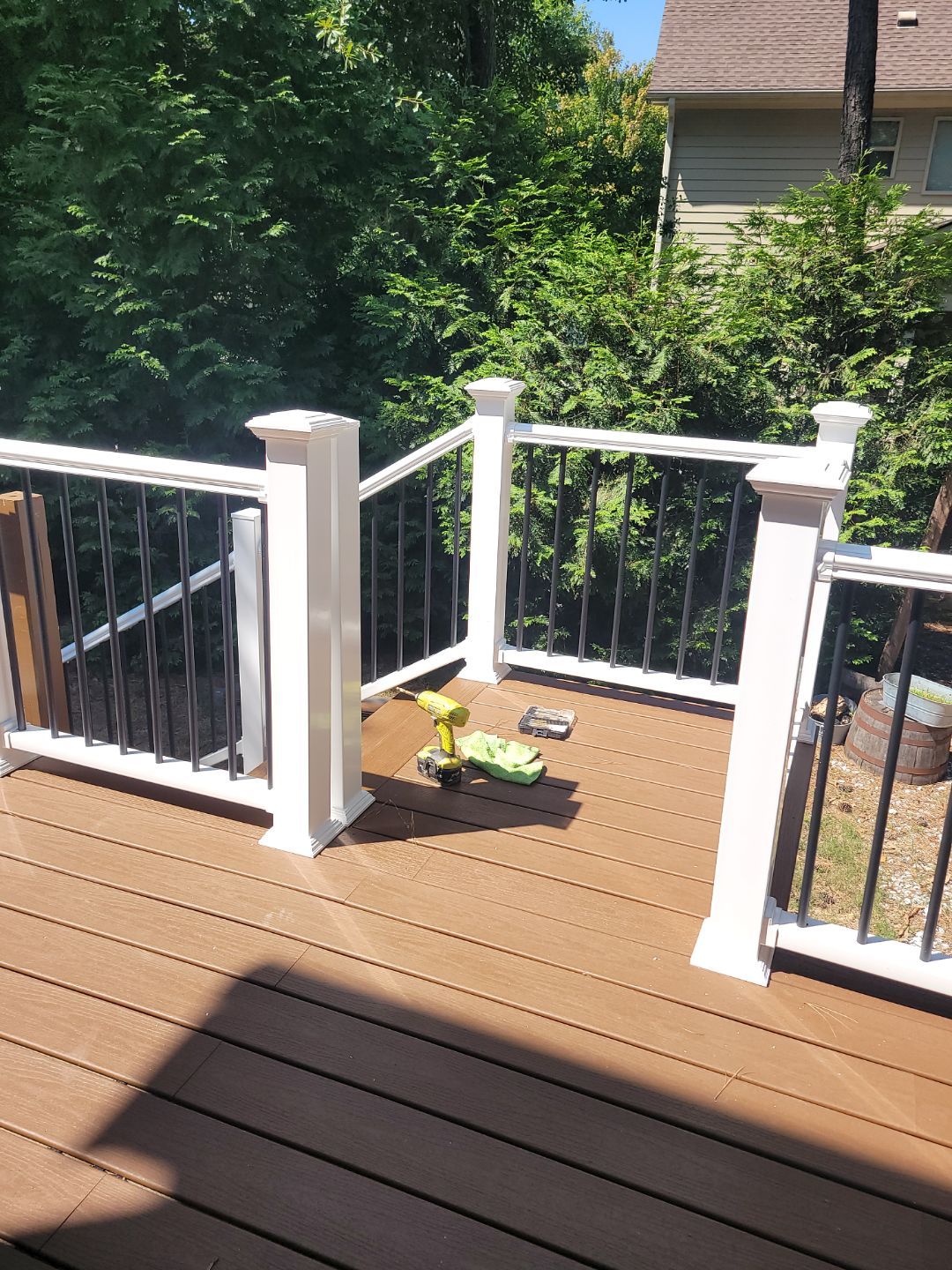 Fuquay-Varina Outdoor Upgrade – Composite Deck & Paved Landing by Elite Remodeling and Design LLC
