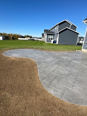 Majestic Ashlar stamped concrete patio with rock face steps 