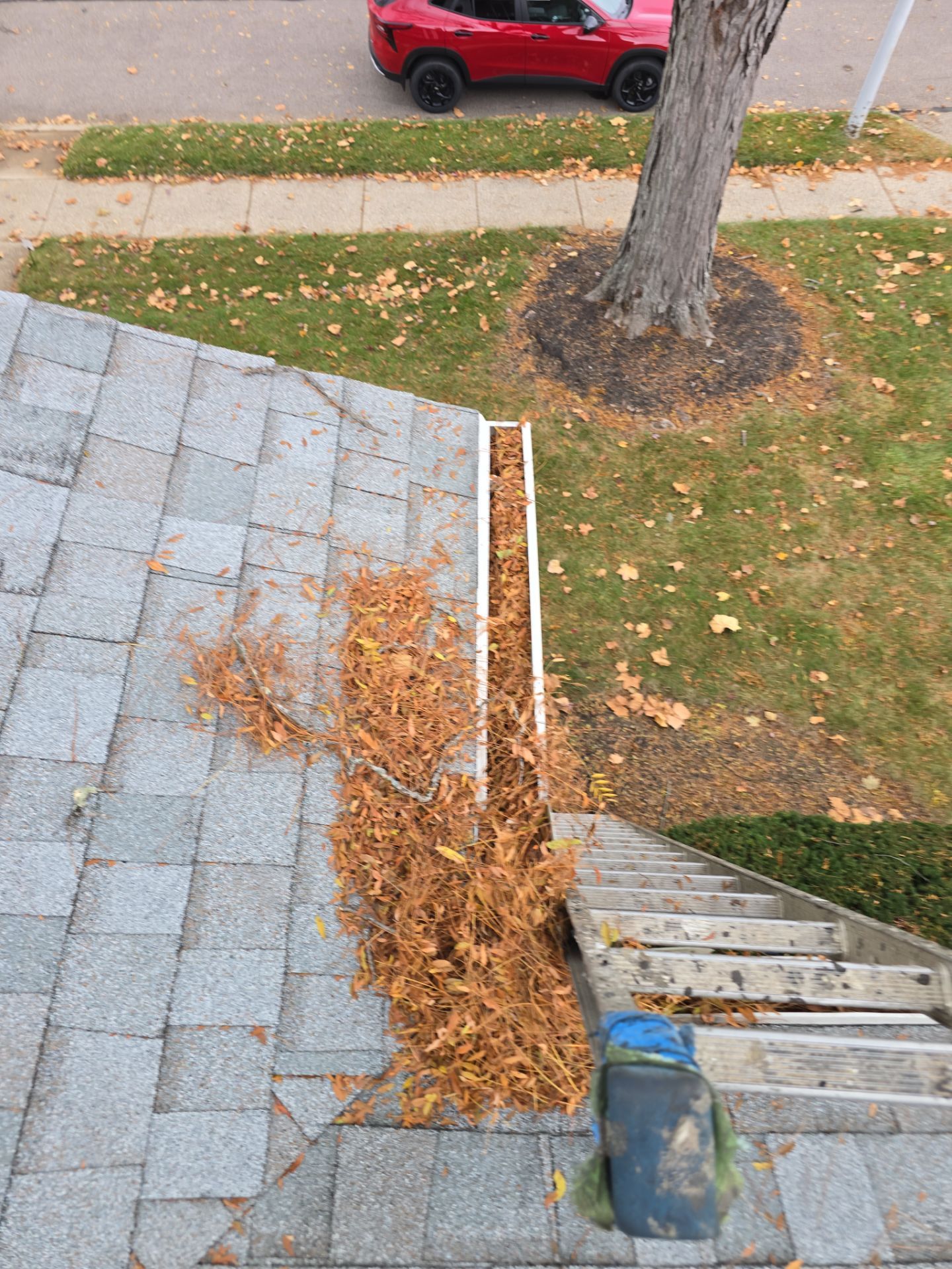 Commercial gutter cleaning Dayton before photo with filled gutters
