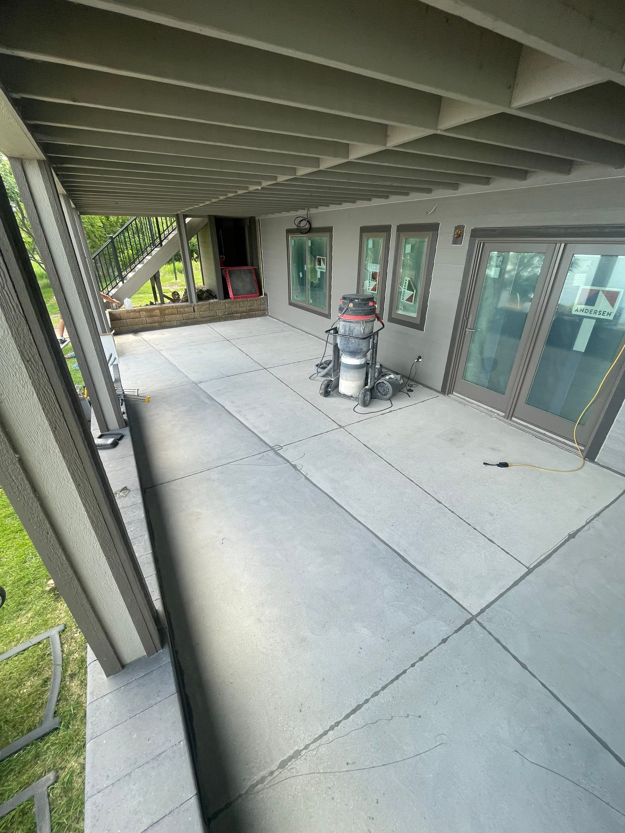 Lakefront Screened Patio Concrete Coating Installation in Wentworth by Select Painting, Coatings & Garage Cabinets