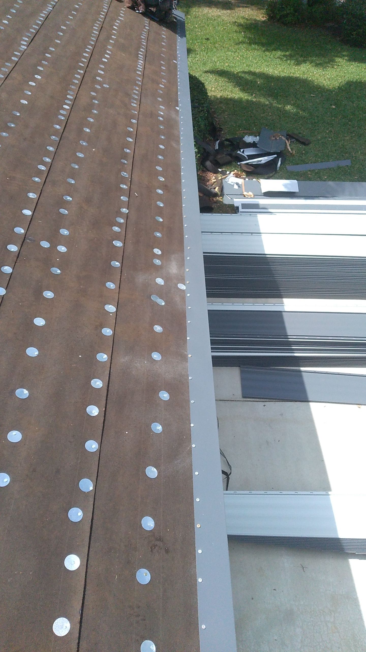 Residential Roofing Installation using 1" Nail strip metal roof by BLUES BROTHERS ROOFING