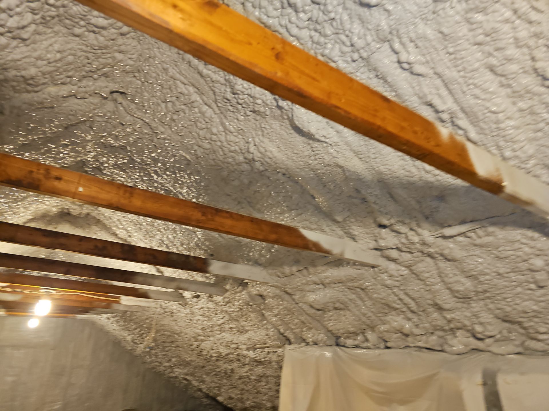 Attic Retrofit using open cell spray foam by NYS Foam & Energy