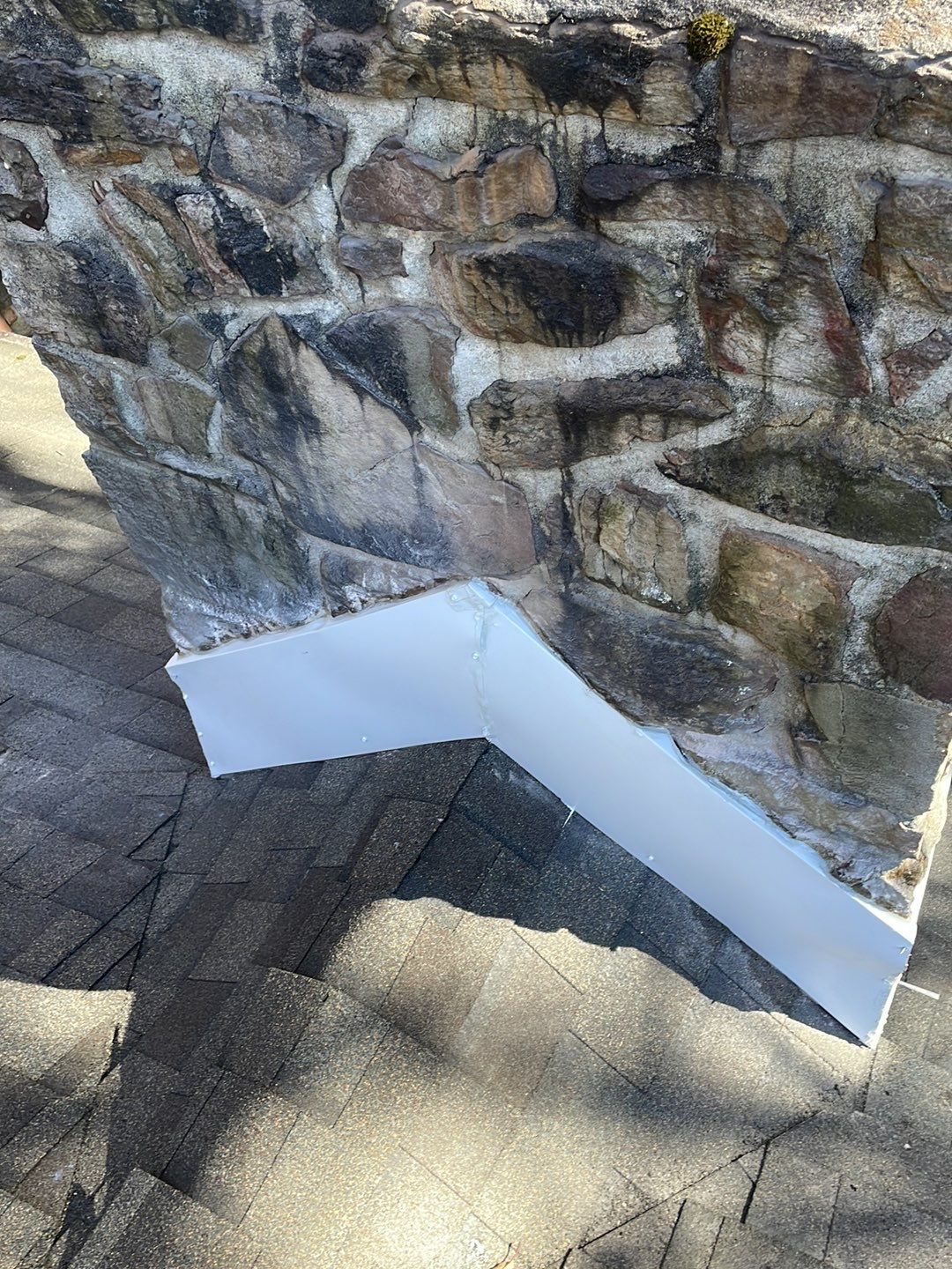 Insurance repair and chimney saddle installation. by Teflon Roofing