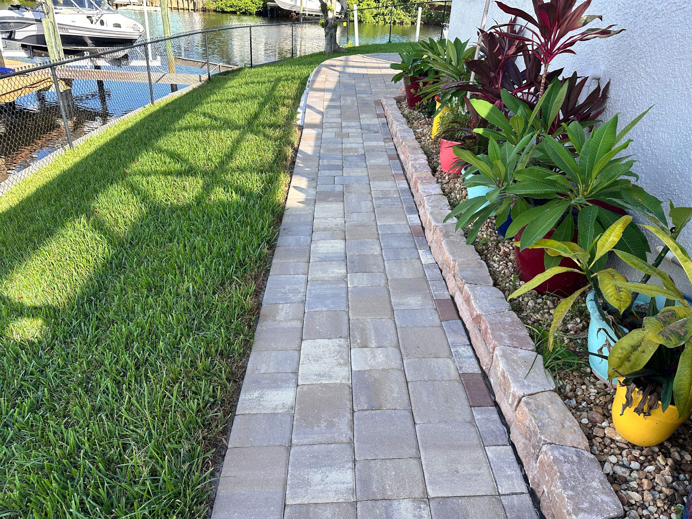 Travertine Sealing and Stripping for a Waterfront Pool Deck in Apollo Beach by Supreme Paver Experts