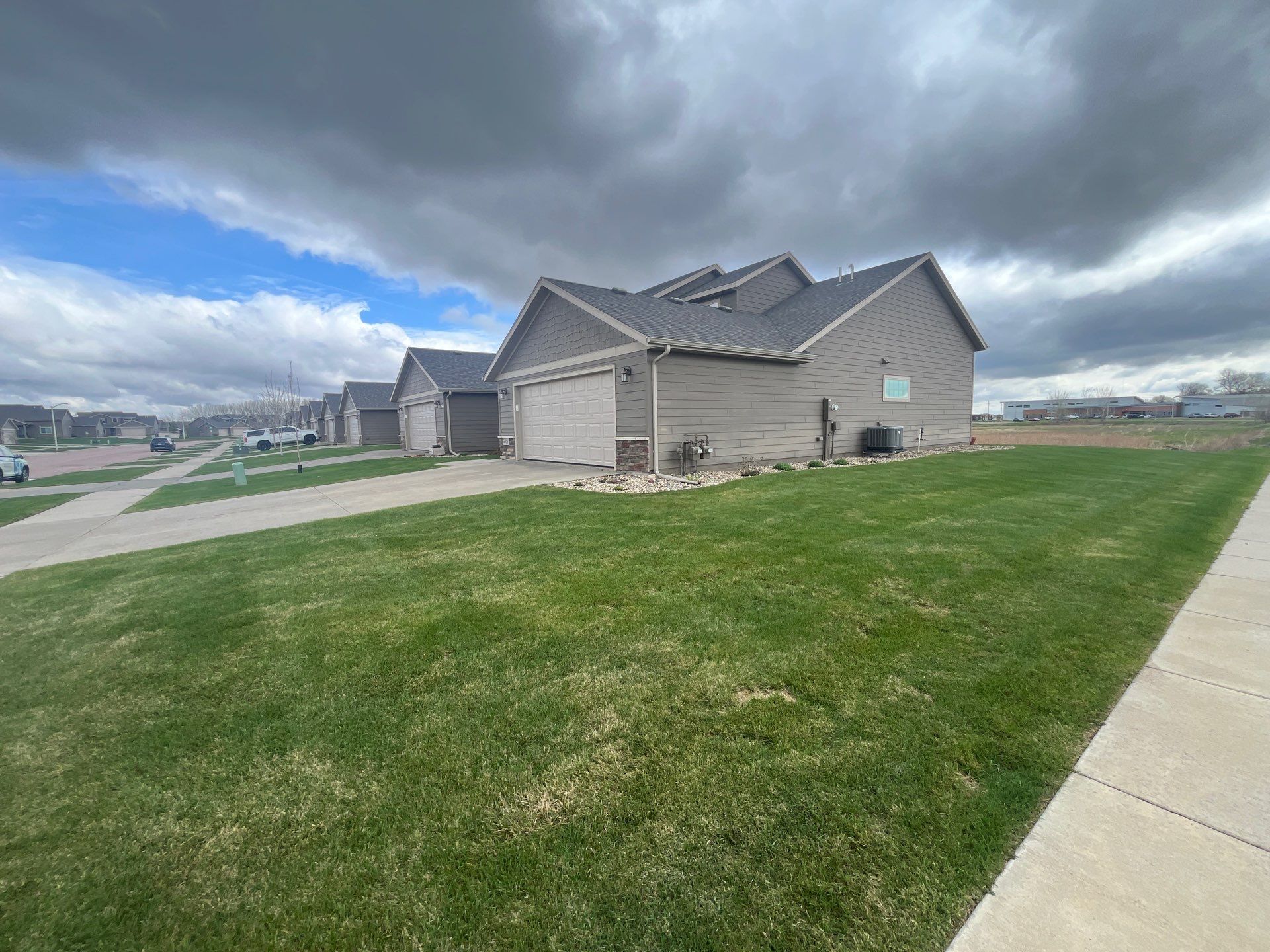 Exterior Painting for Multi-Unit Townhomes in Sioux Falls by Select Painting, Coatings & Garage Cabinets